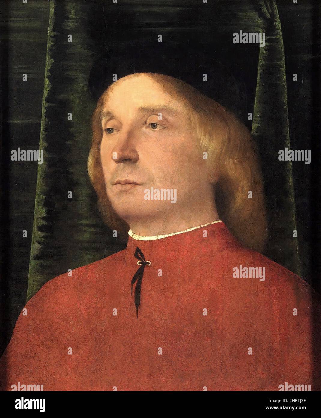 Portrait en demi-longueur d'un jeune homme dans la Robe rouge - 1500 05c.- huile sur bois di tiglio 40 x 32 cm - Lotto Lorenzo Banque D'Images