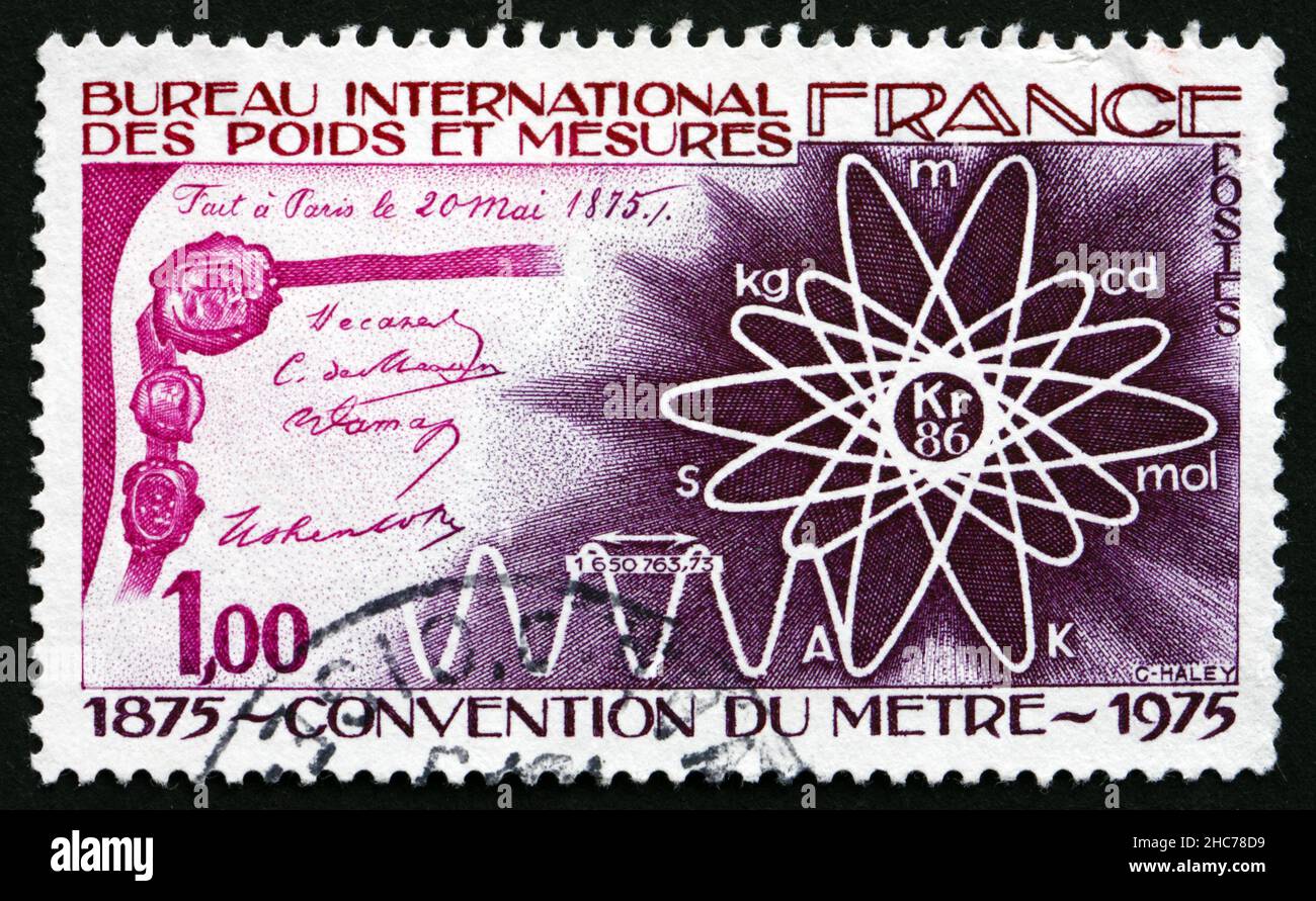 FRANCE - VERS 1975: Un timbre imprimé en France montre le document de la Convention du mètre, diagramme et vagues Atom, Centenaire de l'International Meter Conventio Banque D'Images
