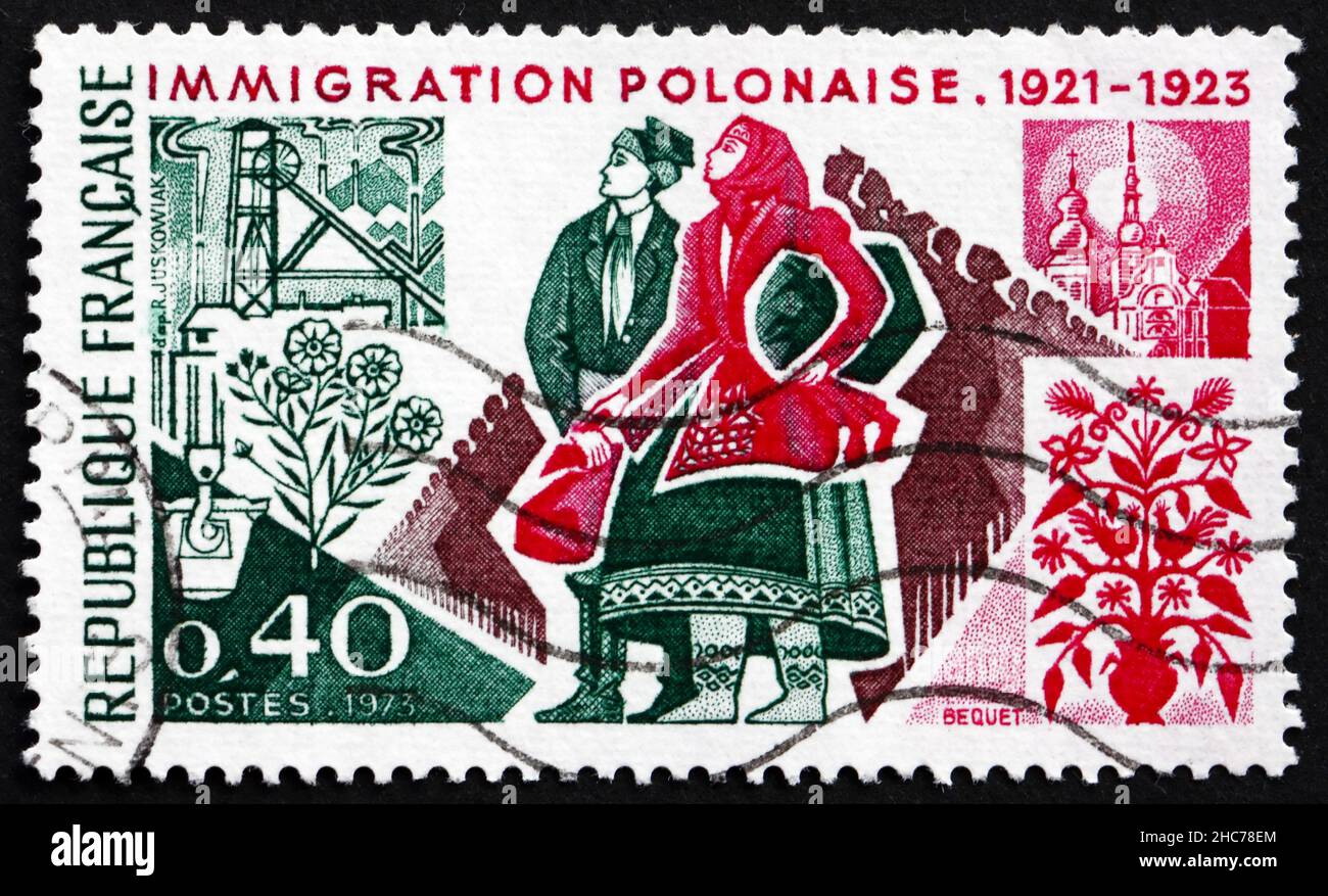 FRANCE - VERS 1973 : un timbre imprimé en France montre les immigrants polonais, 50th anniversaire de l'immigration polonaise en France, 1921-1923, vers 1973 Banque D'Images
