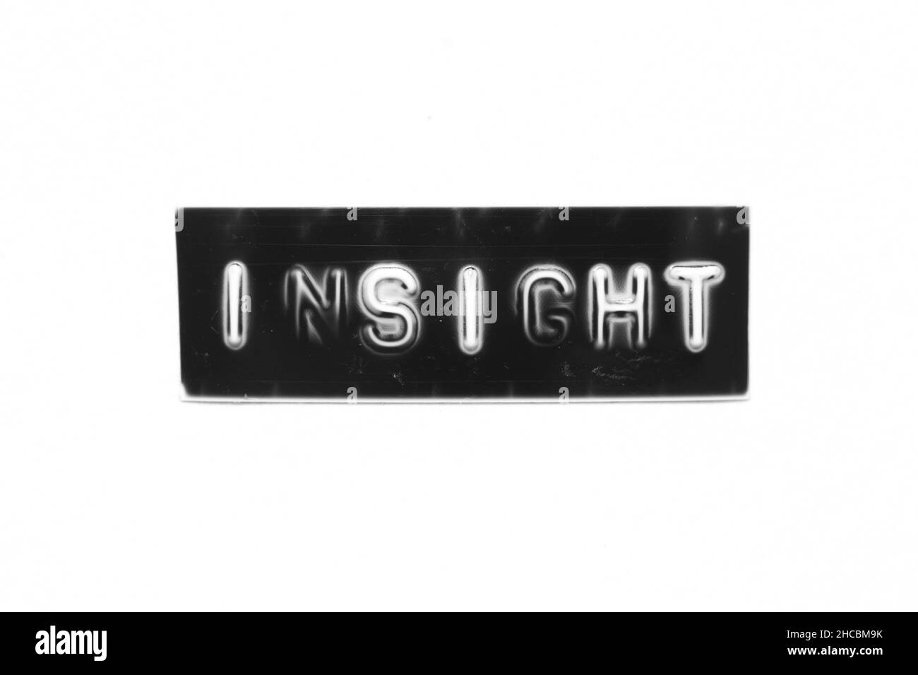 Bannière noire avec lettre en relief et mot InSight sur fond de papier blanc Banque D'Images