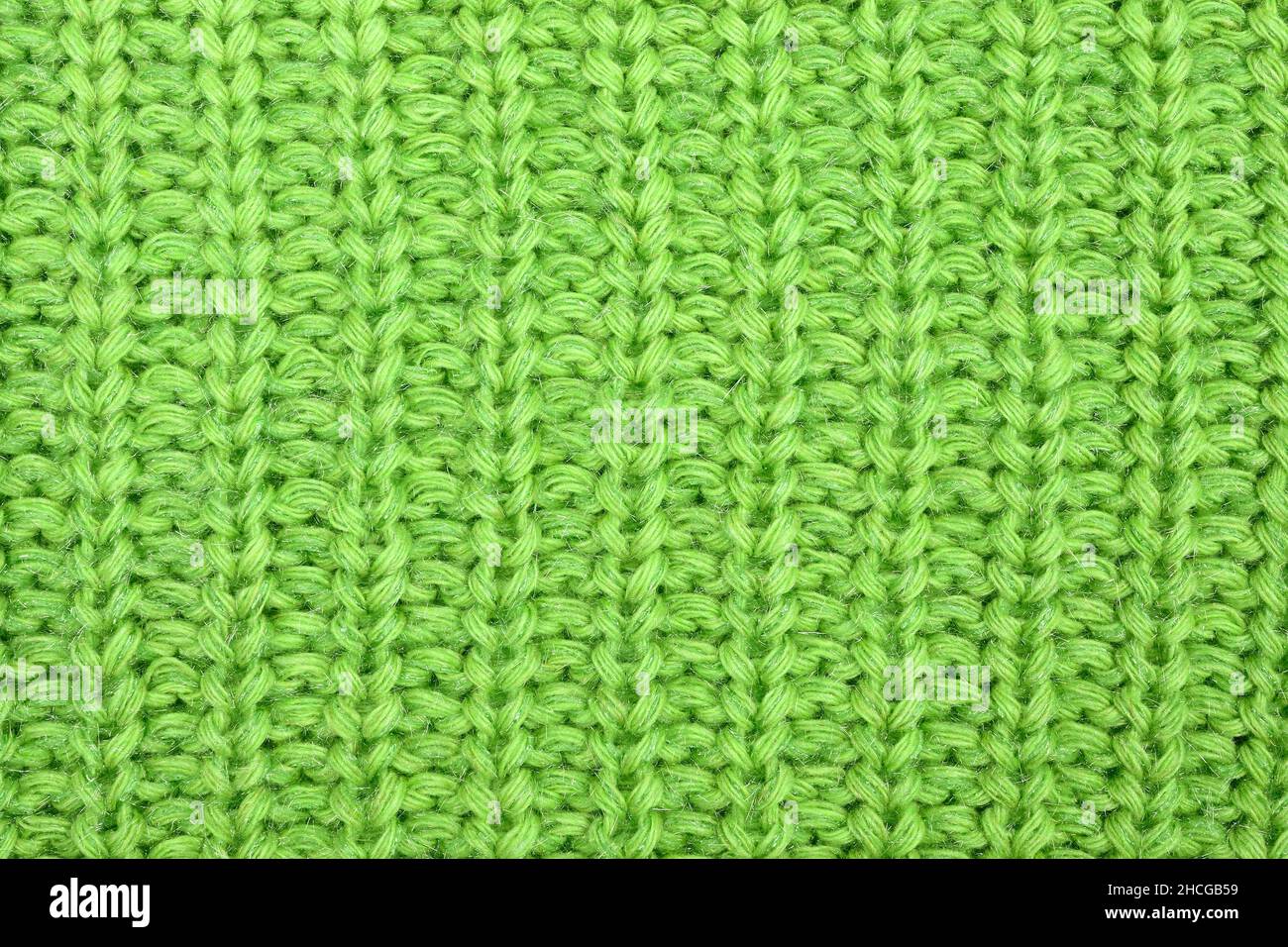 Fond texturé de chandail vert, vue de dessus du tissu en maille Banque D'Images