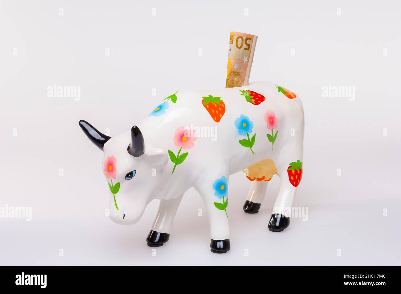 Caisse en porcelaine, vache, fleurs, fraises, billets de banque Banque D'Images