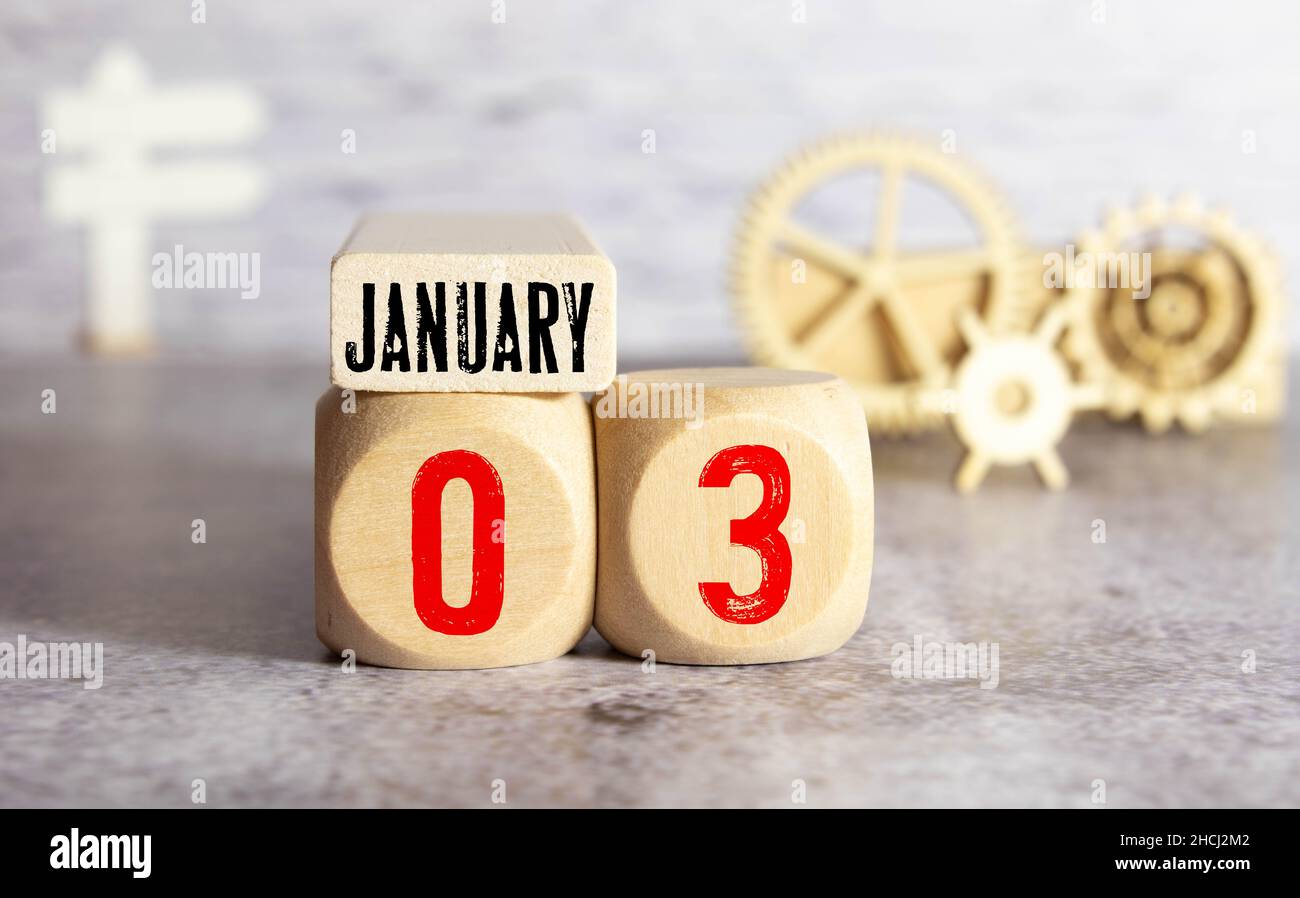 Janvier 3 blanc cube calendrier en bois sur bois vintage et fond blanc avec le jour d'hiver, CopySpace pour le texte. Banque D'Images