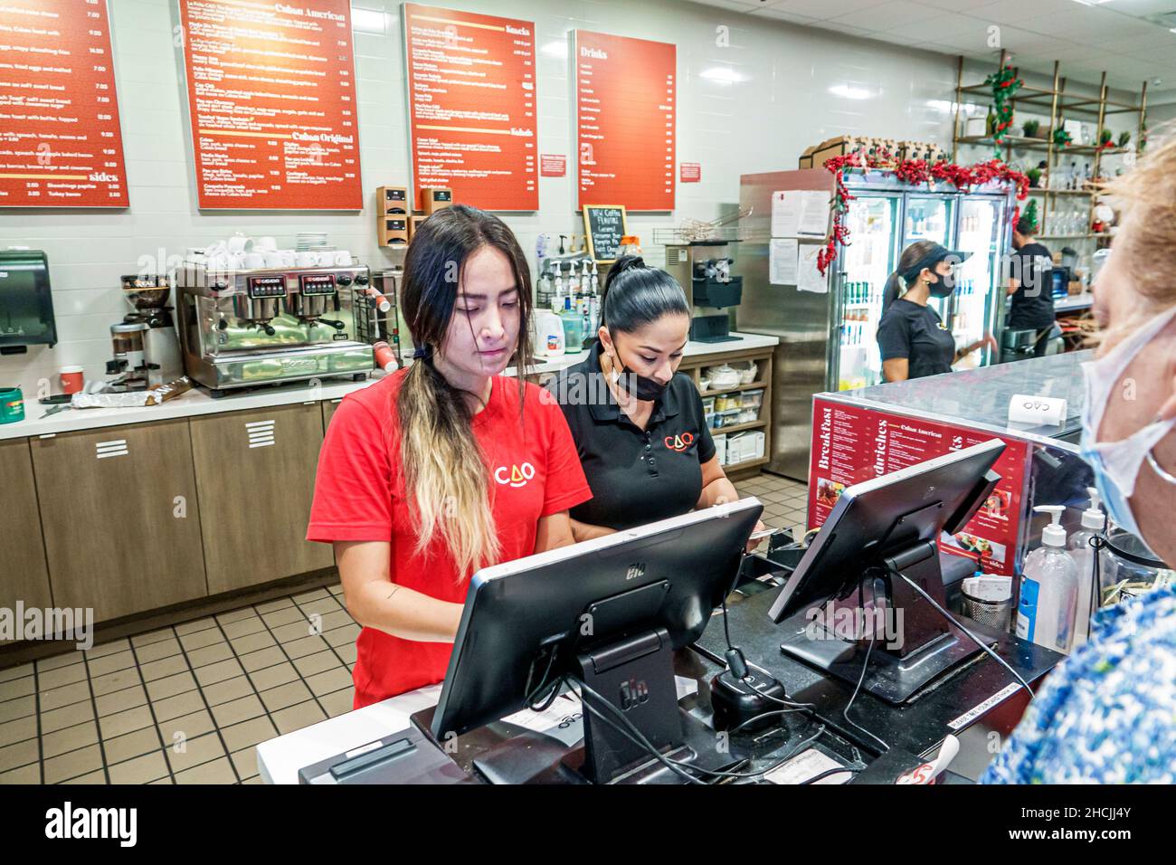Miami Beach Florida CAO Bakery & Cafe intérieur intérieur hispanique femme femme femme femme employée travailleur caisse Banque D'Images