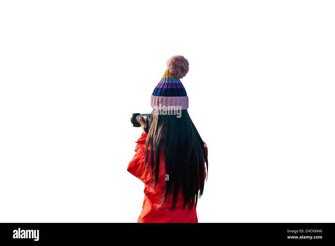 Jeune femme qui prend des photos avec un arrière-plan blanc isolé d'appareil photo numérique. Banque D'Images