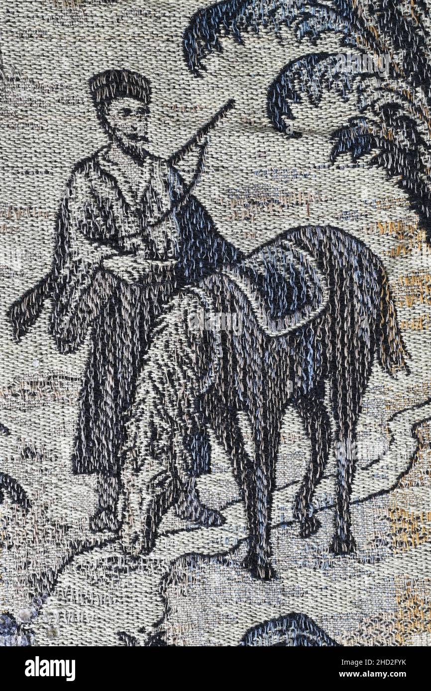 Cavalier oriental avec carabine sur une couverture tissée Art déco Banque D'Images