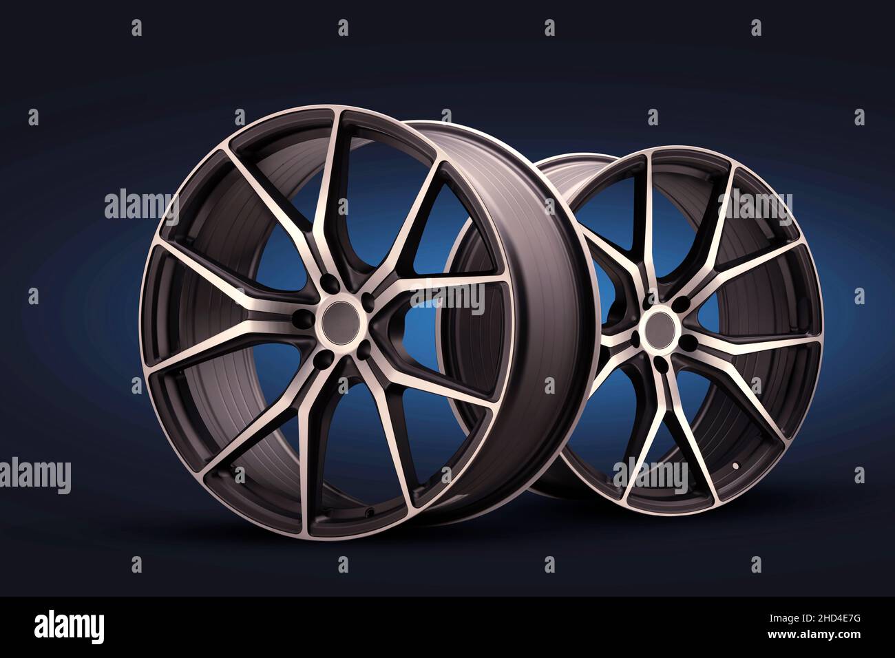 nouvelles roues en alliage forgé sur fond bleu noir. roues sport fraîches avec rayons fins, réglage automatique du poids léger. Banque D'Images