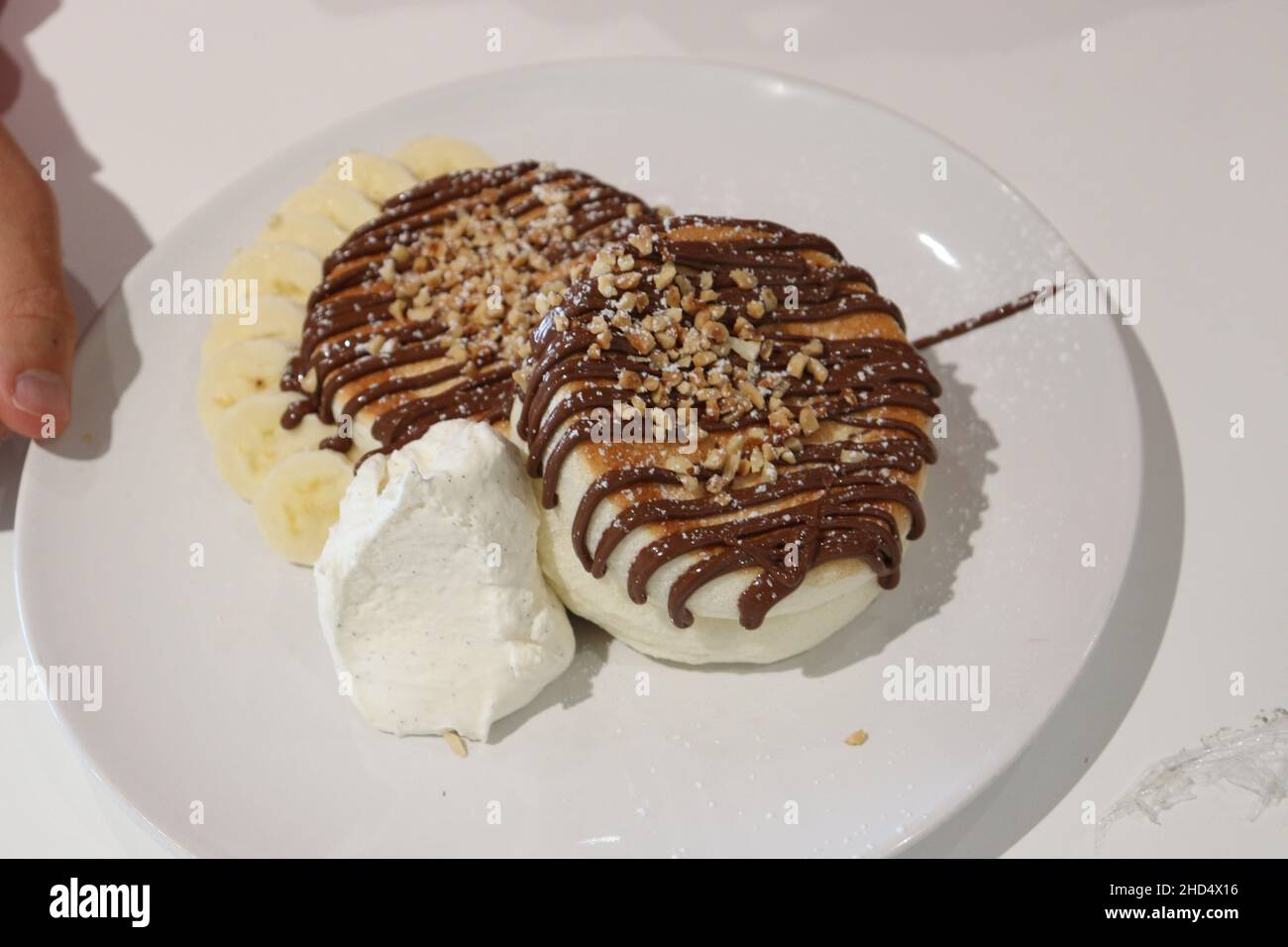 Crêpes japonaises moelleuses au Fuwa Fuwa à Londres, servies avec du sirop et du beurre en nid d'abeille. Banque D'Images