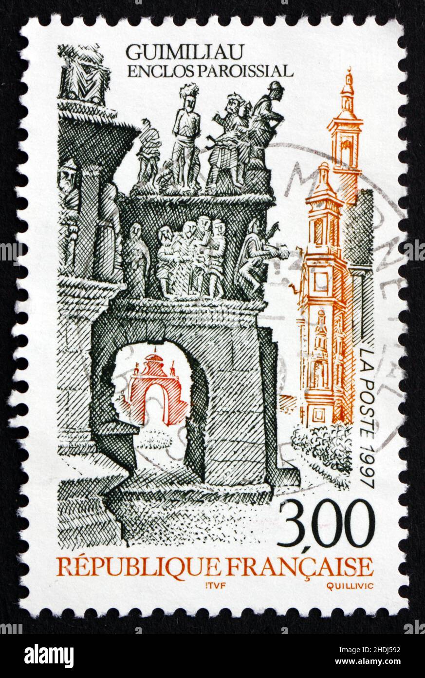 FRANCE - VERS 1997 : un timbre imprimé en France montre l'église Guimiliau Close, Finistère, Bretagne, vers 1997 Banque D'Images