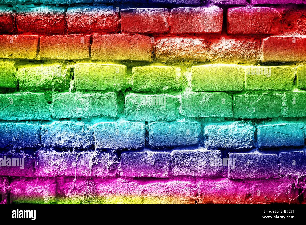 Résumé couleurs arc-en-ciel mur de briques vue d'arrière-plan, rouge, jaune, vert, bleu Banque D'Images