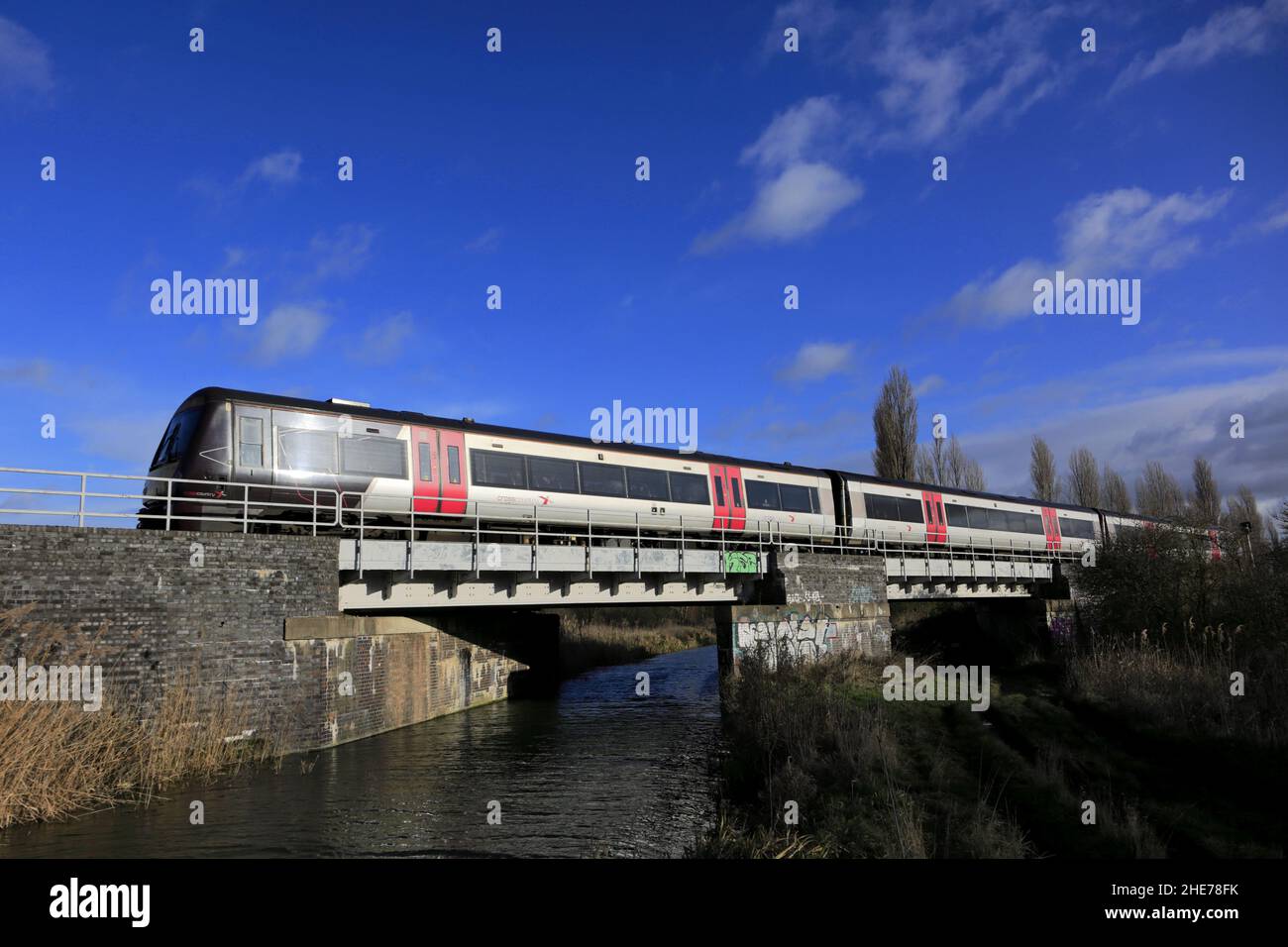 170106 C2C train près de la ville de Whittlesey, Fenland, Cambridgeshire, Angleterre Banque D'Images