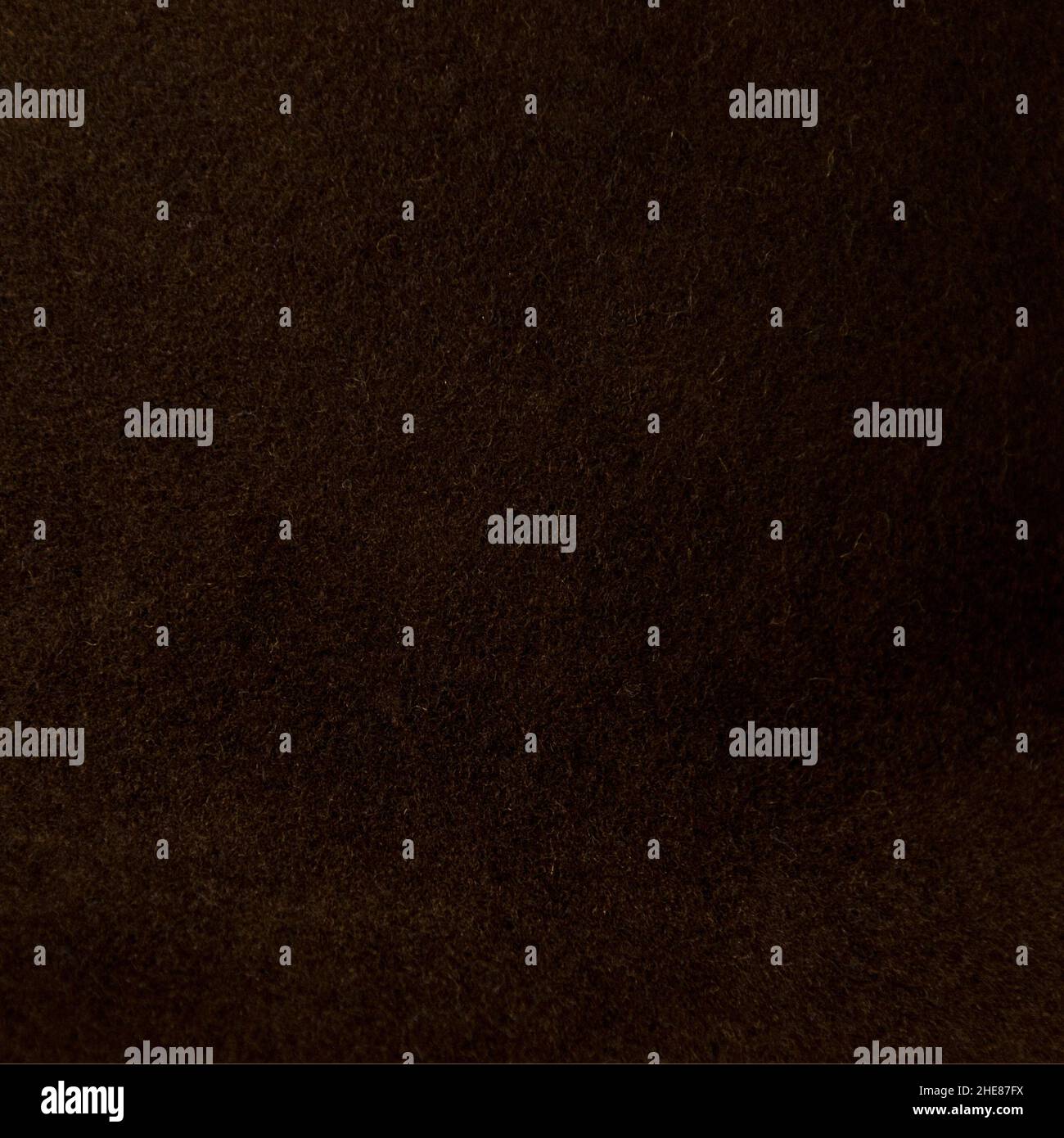 Gros plan d'une clôture et d'un tissu brun foncé fait de fil synthétique Banque D'Images