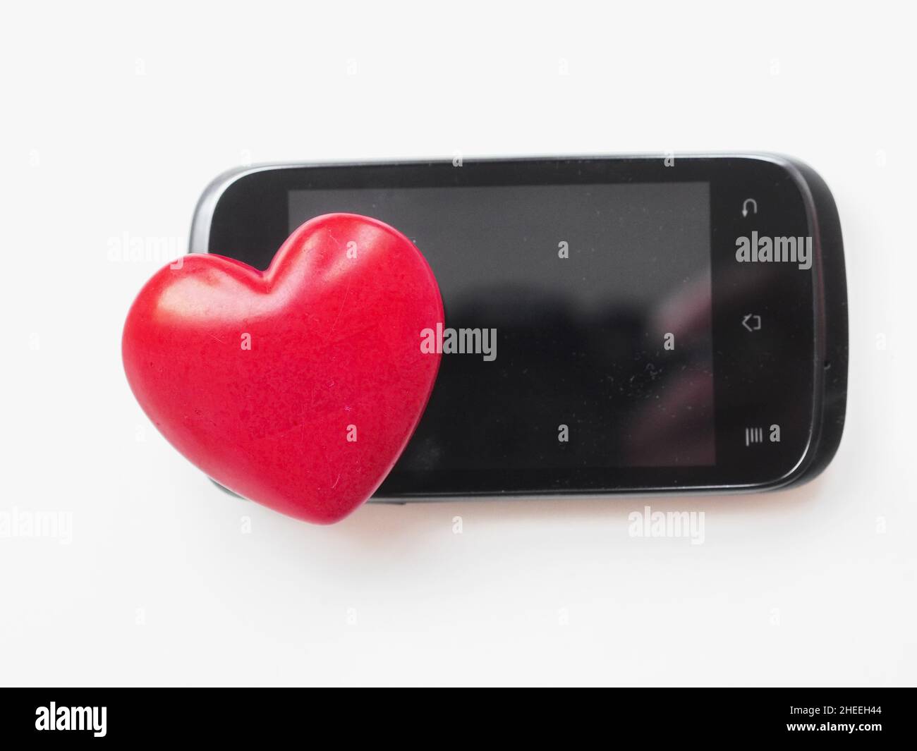 le smartphone aime le cœur Banque D'Images