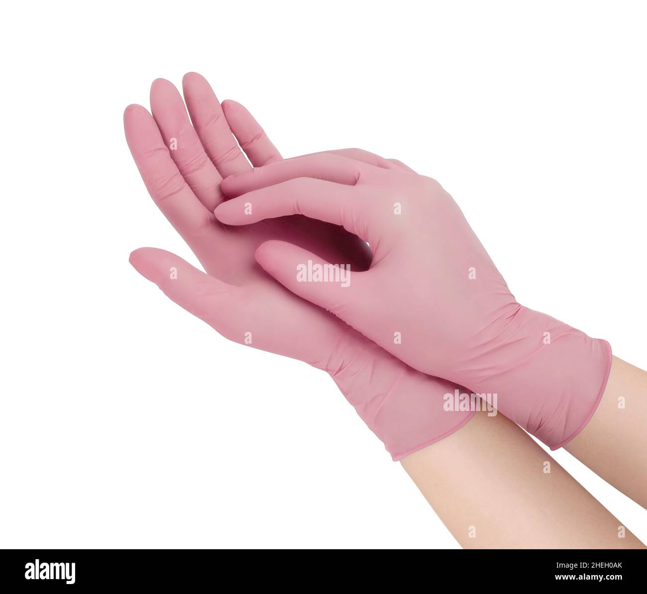 Gants médicaux.Deux gants chirurgicaux roses isolés sur fond blanc avec les  mains.Fabrication de gants en caoutchouc, la main humaine porte un gant en  latex Photo Stock - Alamy