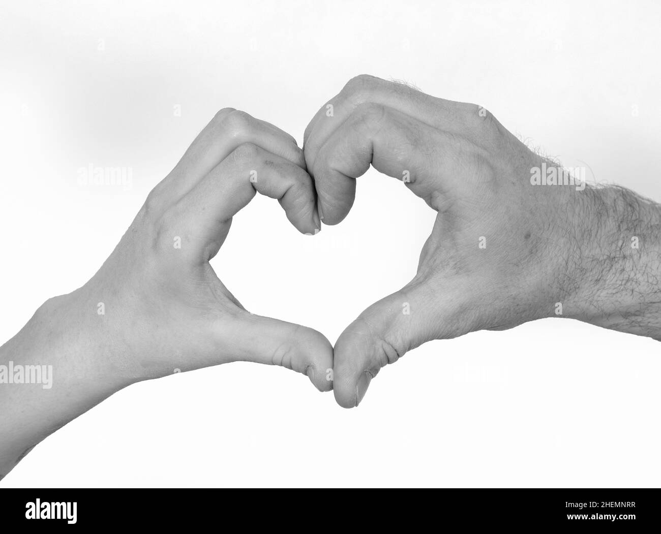 doigt montrant le signe de l'amour en construisant un coeur comme symbole Banque D'Images