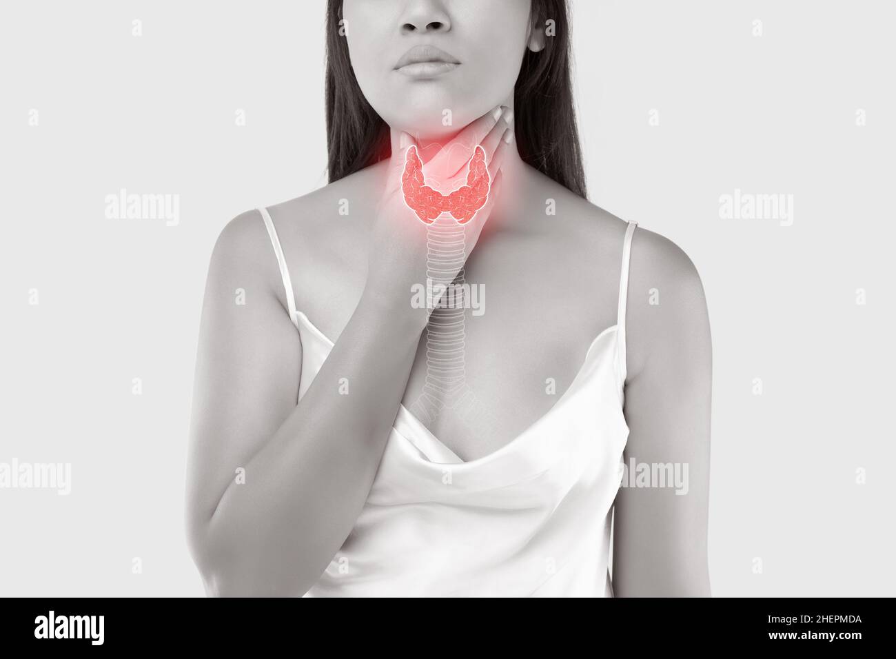 L'illustration de la thyroïde est sur le corps de la femme contre le fond gris.Organes internes du corps humain Banque D'Images