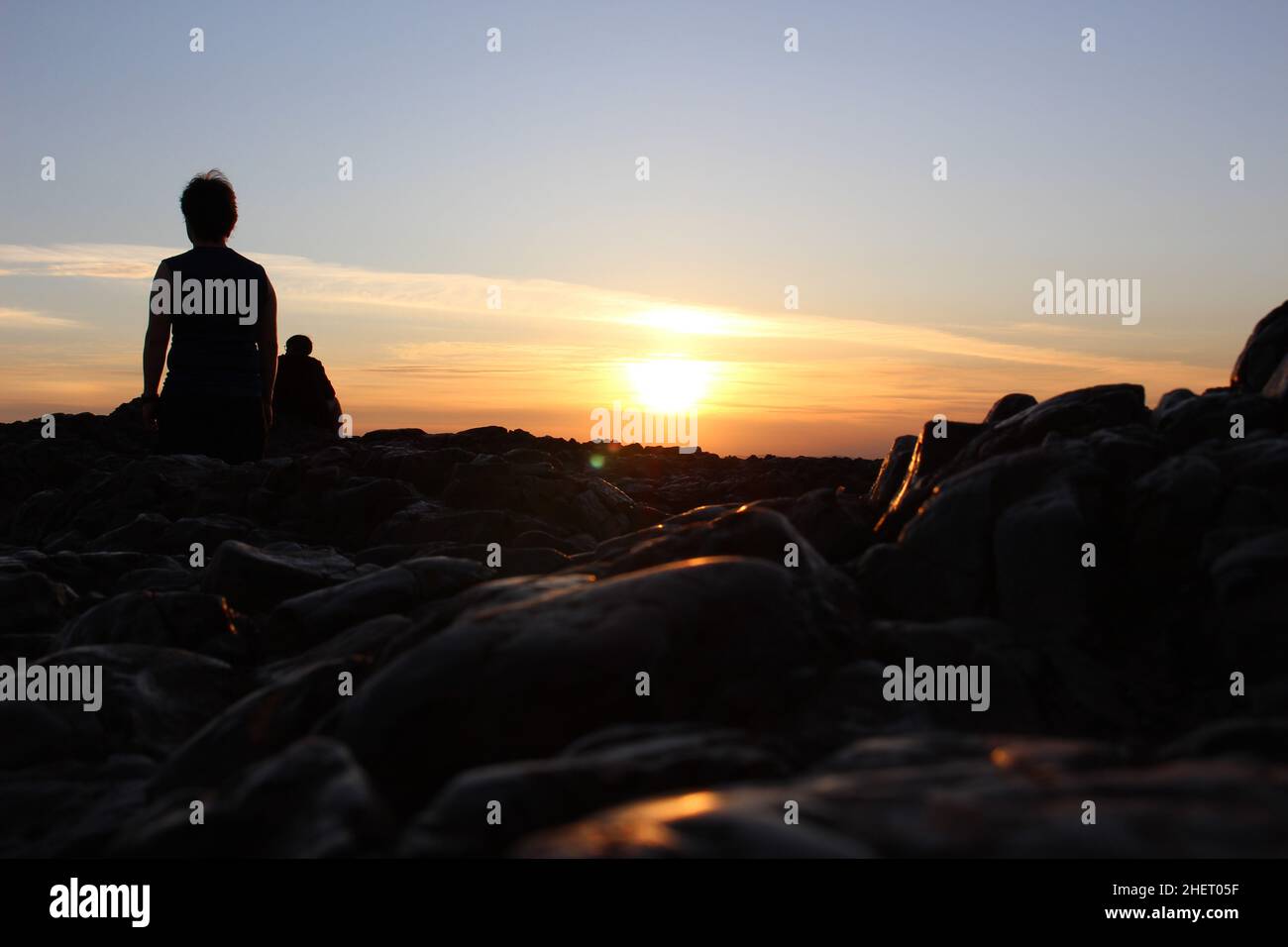 Silhouettes au coucher du soleil sur Arthur's Seat, Édimbourg, Écosse Banque D'Images