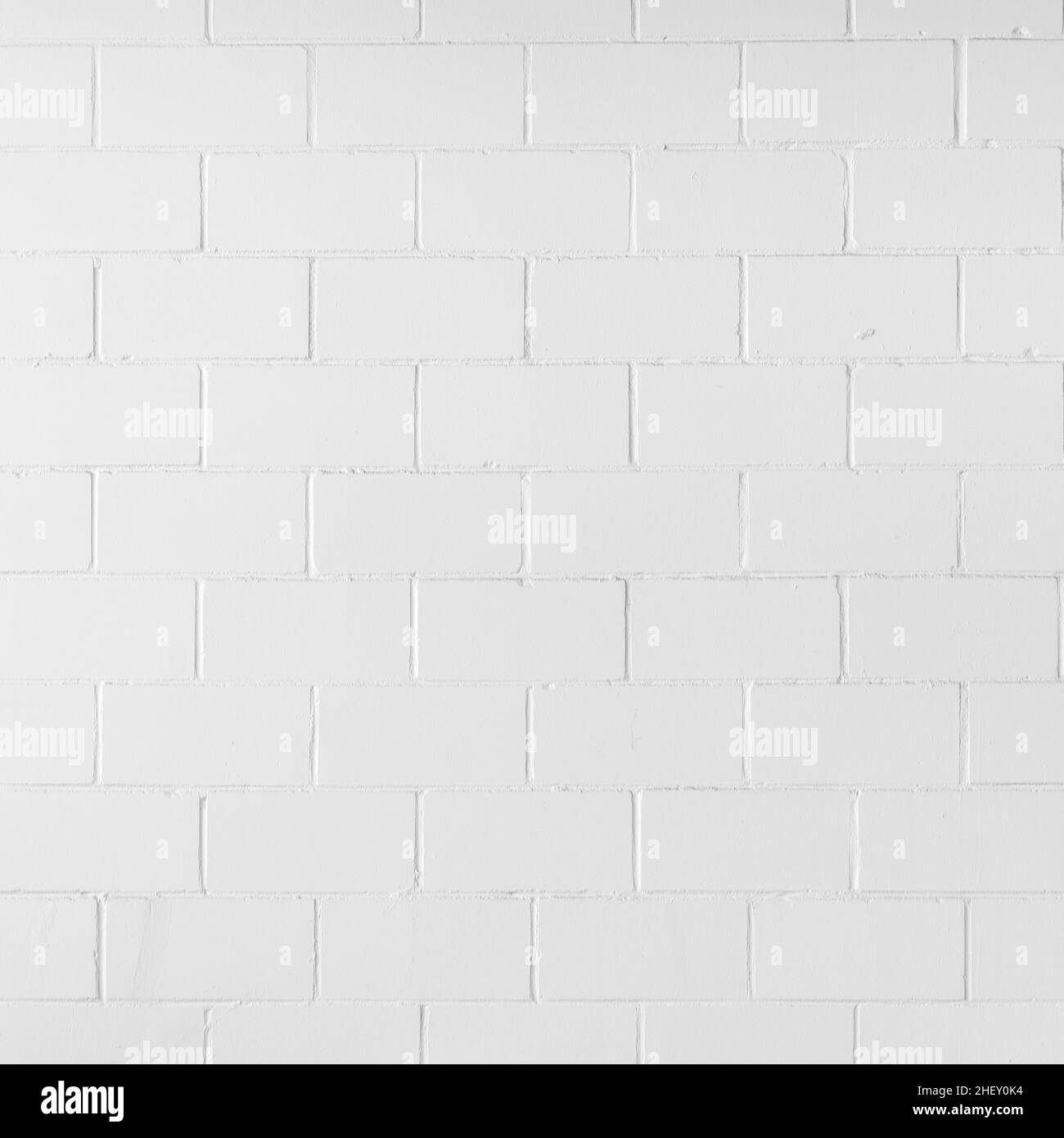 détail de l'arrière-plan de mur en brique blanche dans un motif harmonique Banque D'Images