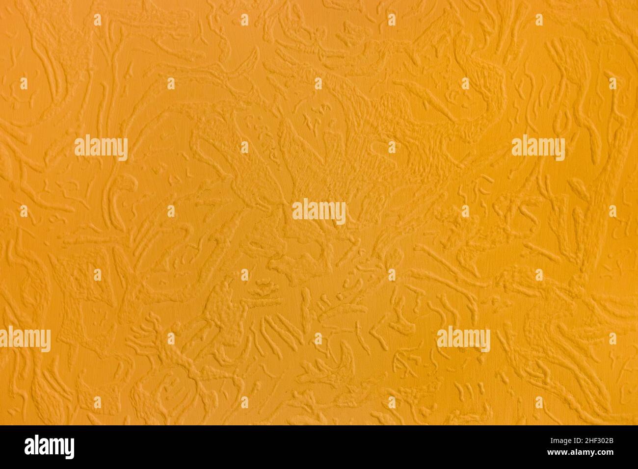 Motif abstrait plâtre orange texture mur surface stuc fond. Banque D'Images