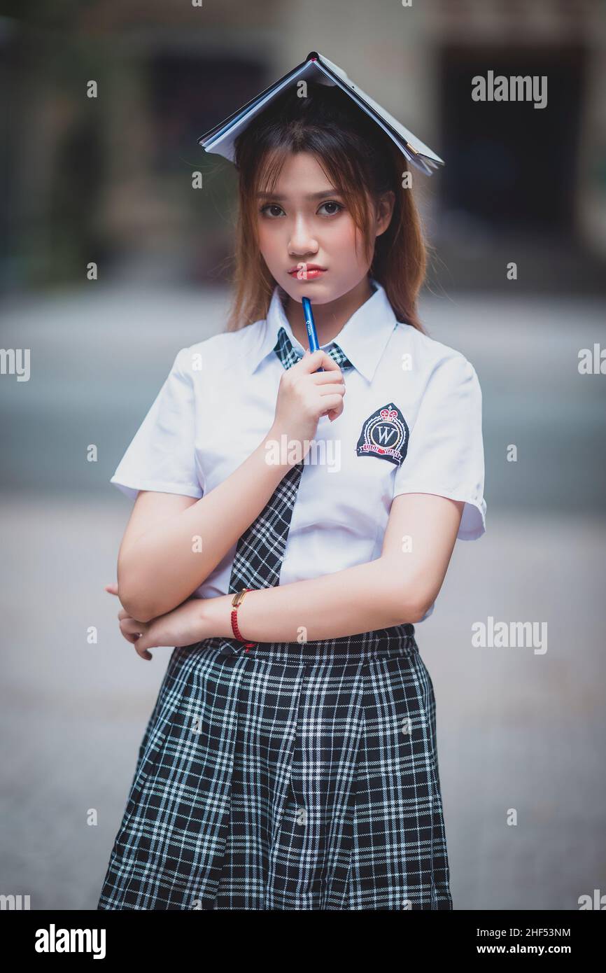 Ho Chi Minh ville, Vietnam: Portrait de la belle fille vietnamienne en uniforme scolaire Banque D'Images