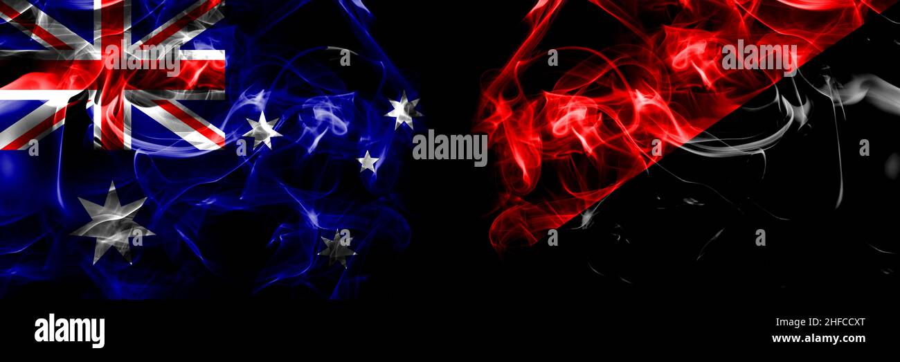 Drapeaux de l'Australie, australien contre anarchiste, anarcho, syndicaliste, communiste,Socialiste.Drapeau de fumée placé côte à côte sur fond noir. Banque D'Images