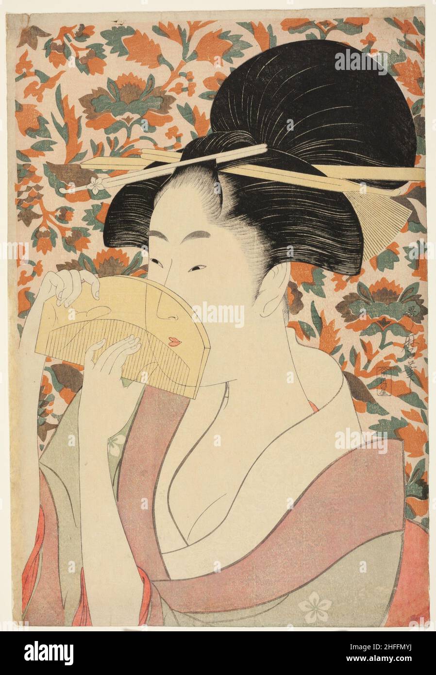 Femme tenant un peigne à cheveux tortue, Japon, c.1795/96. Banque D'Images