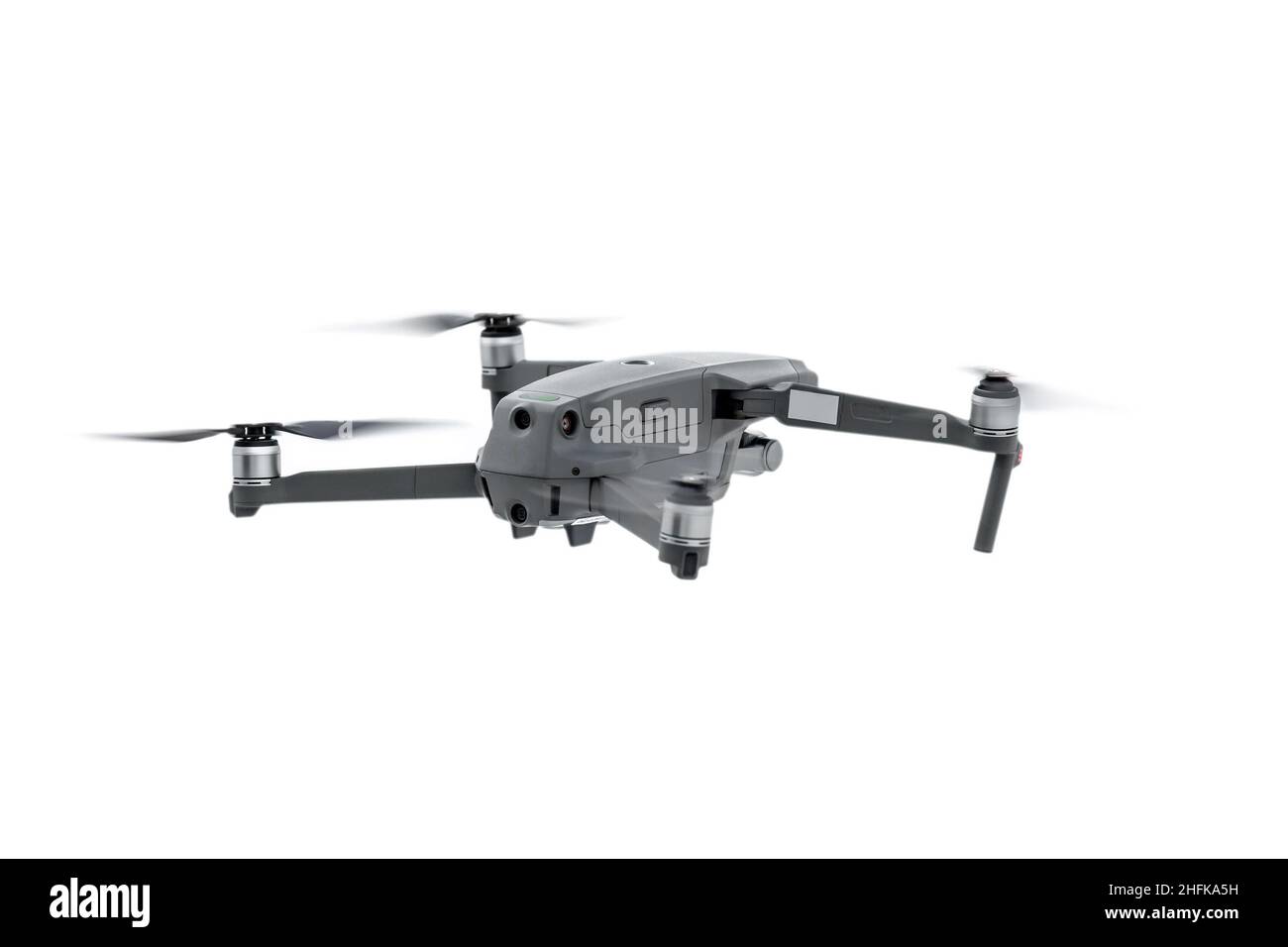 Drone gris en vol, sur fond blanc Banque D'Images