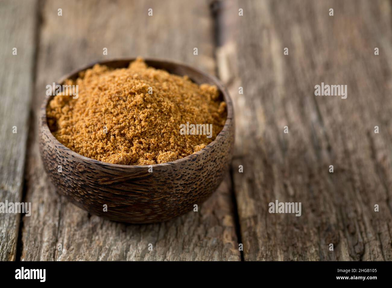 sucre de noix de coco sur surface en bois Banque D'Images