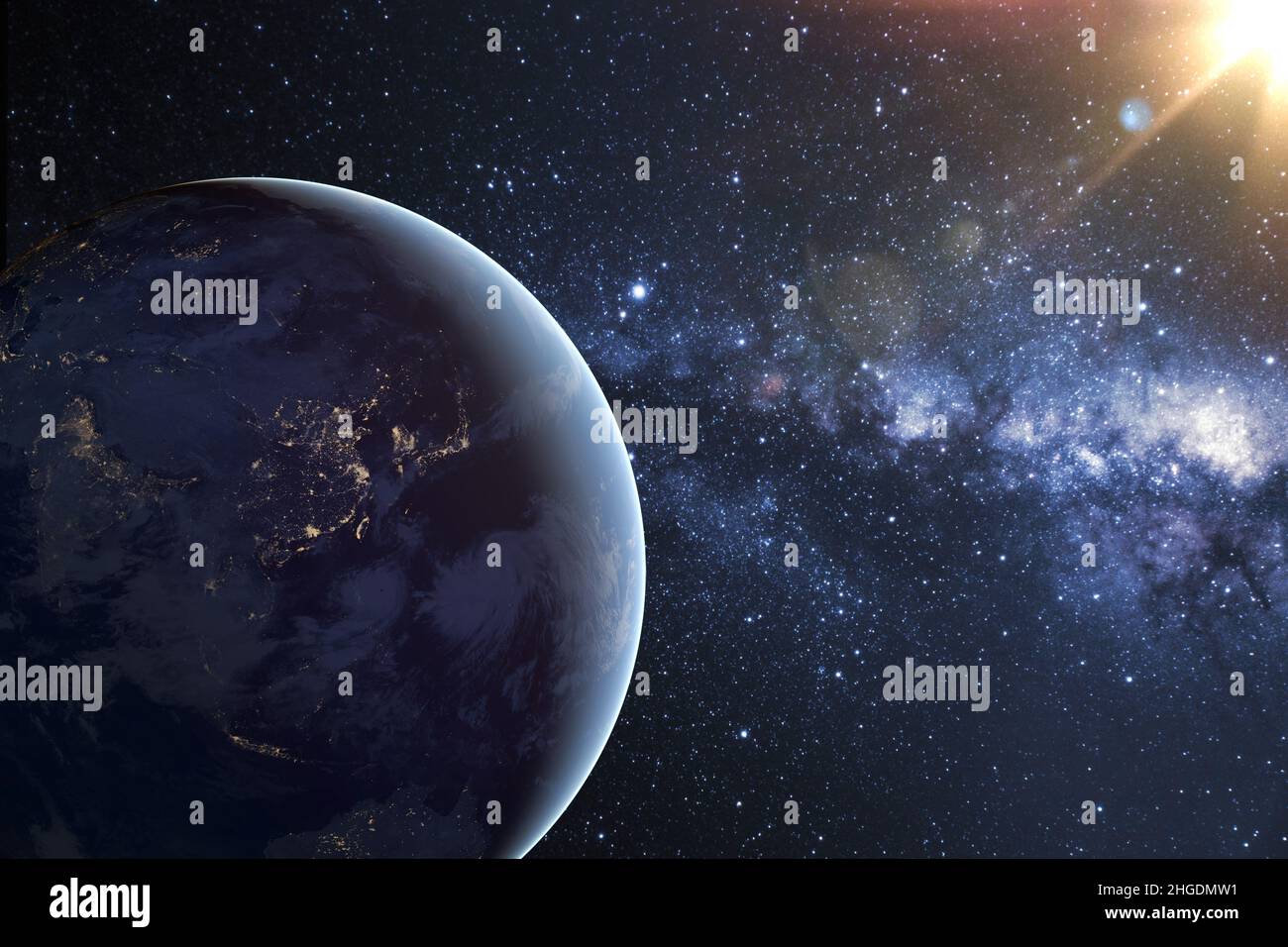 Planète Terre planète dans l'espace profond contre la nébuleuse bleue et le soleil brûlant.Vue de nuit depuis l'orbite de la planète avec les lumières des villes et le soleil éloigné. Banque D'Images