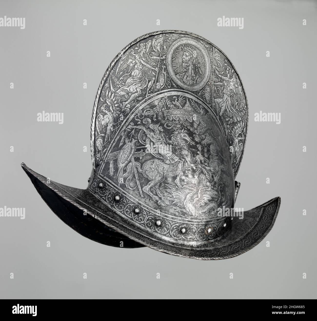 Peigne Morion env.1560–65 Allemand, Brunswick ce casque est un exemple remarquable d'armure de parade faite dans le nord de l'Allemagne pour la cour du duc Heinrich le plus jeune de Brunswick-Wolfenbüttel (r.1514–68) et son fils Julius (r.1568–89).Caractéristique de l'école de Brunswick est la décoration figurale proéminente et finement gravée, avec des sujets historiques, mythologiques et bibliques.la gravure sur ce morion est exceptionnellement accomplie et comprend (sur le peigne surélevé) des médaillons de portrait d'Alexandre le Grand et Antonia Sabina Augusta, épouse de l'empereur romain Hadrien.Le subjec classique Banque D'Images
