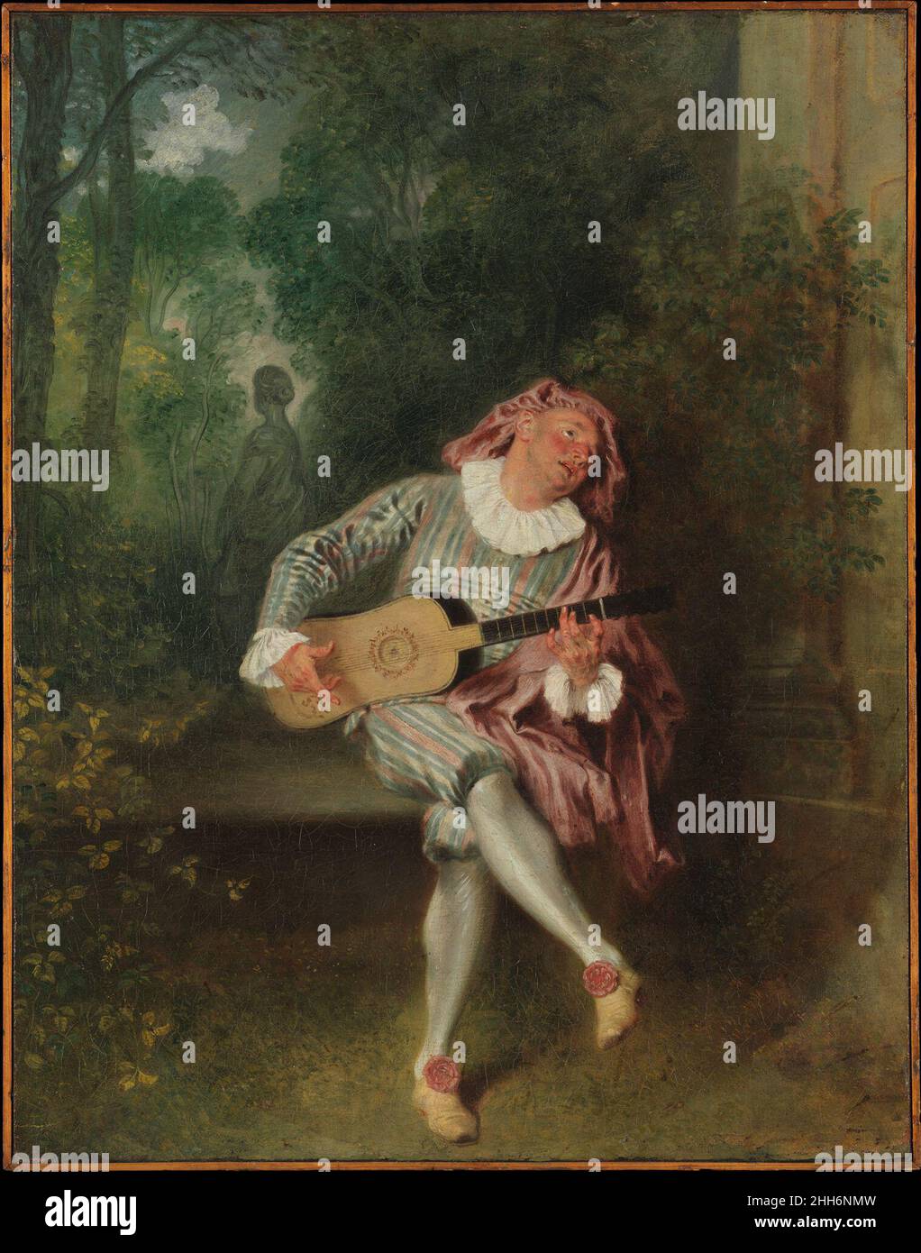 Mezzetin ca.1718–20 Antoine Watteau French Mezzetin, un personnage de la comique italienne dell’arte, est devenu un interprète établi sur la scène parisienne, mais a été un sujet innovant pour la peinture dans la vie de Watteau.Ici Mezzetin habite les jardins surcultivés que Watteau aime.Son costume était typiquement composé d'une veste rayée et de genouillères, d'un chapeau de disquettes, d'une ruche, et d'une cape courte; sa personnalité était à tour interférant, sournois, et lovelorn, comme l'a indiqué la statue lointaine de la femme qui la retourne à lui.Le toucher délicat de Watteau, particulièrement évident sur la fig. Banque D'Images