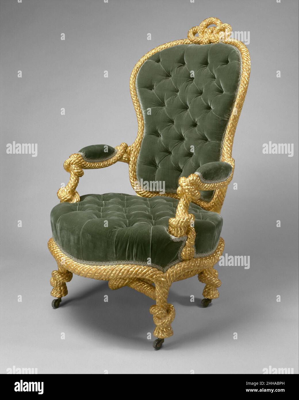 Fauteuil ca.1860 la manière de A. M. E. Fournier avec son arrière et son siège profondément touffeté, ce fauteuil innovant et amusant incarne le désir d'originalité et de variété combiné à un souci de confort qui était caractéristique du second Empire.Les meubles de siège sculptés de cette façon sont généralement associés à l'ameublement parisien A.M.E.Fournier, qui a fourni au moins un tabouret de corde, maintenant au Musée National du Château de Compiègne.Fauteuil 209222 Banque D'Images