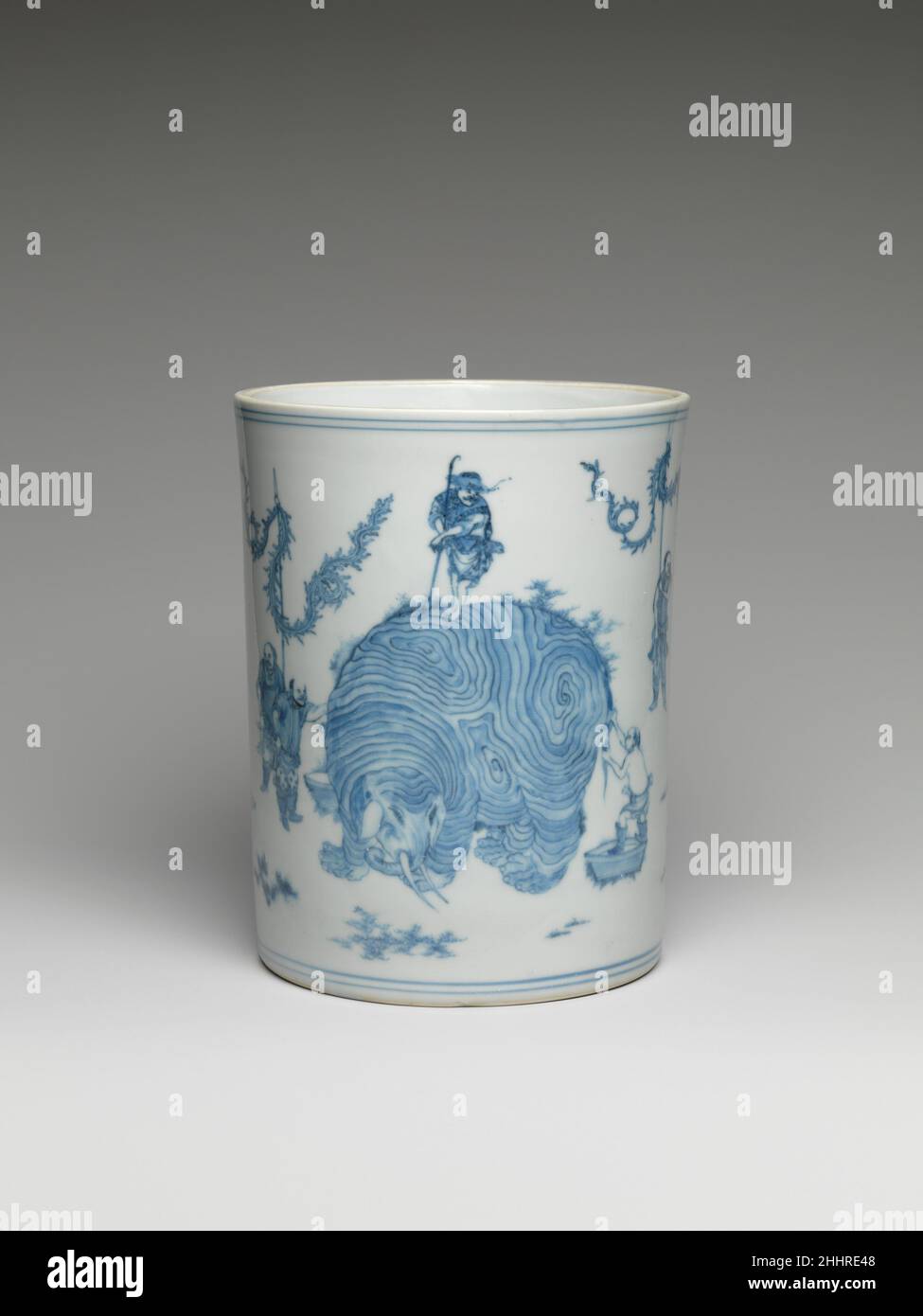 Pinceau Pot avec scène de laver un éléphant mi-17th siècle Chine trouvé dans les peintures ainsi que les arts décoratifs, le thème des figures laver un éléphant, ou sao xiang, est un pun sur la notion bouddhiste de la nature illusionnaire du monde phénoménal.Pot à brosse avec scène de lavage d'un éléphant 74336 Banque D'Images