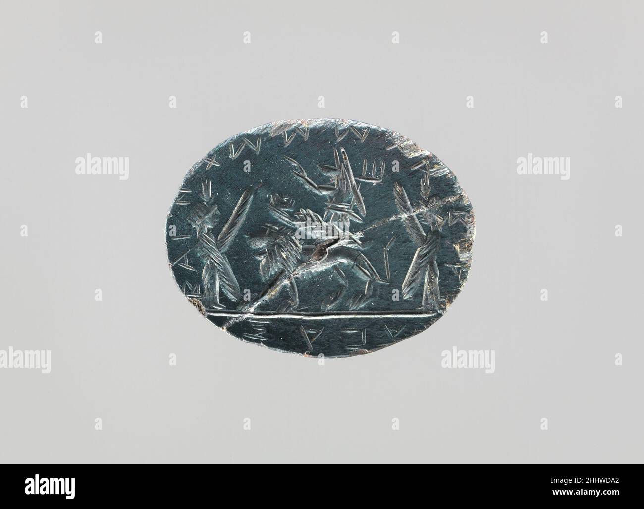 Hématite intaglio: Momie d'Osiris ca.2nd–3rd siècle A.D. momie romaine d'Osiris portée sur le dos d'un lion, accompagnée d'Anubis et flanquée de deux déesses ailées (Isis et Nephthys), inscrite autour de la marge: Bainchooch abrax, et sur l'envers deux lignes de caractères avec les sept voyelles grecques dans l'ordre.Hématite intaglio : momie d'Osiris 248225 Banque D'Images