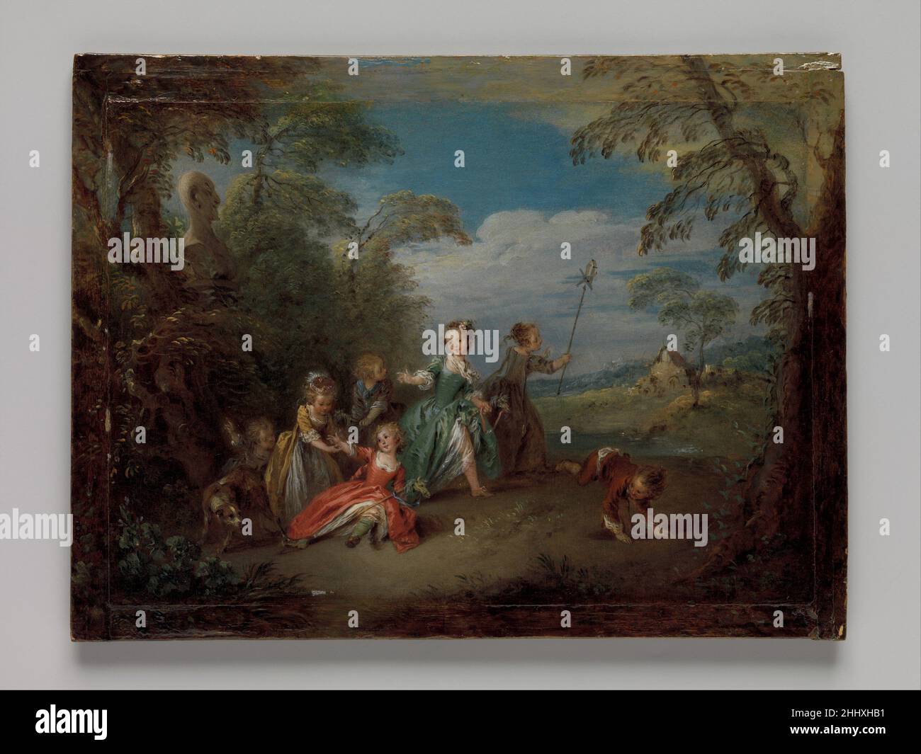 L'âge d'or Jean-Baptiste Joseph Pater French Pater était le seul étudiant officiel d'Antoine Watteau (1684–1721), qui a été le pionnier des sujets de jardins surcultivés peuplés d'hommes et de femmes bien habillés engagés dans des activités amoreuses.Dans cette peinture exceptionnellement bien préservée, Pater utilise la technique de peinture de Watteau, les poses de figuratures et l’humeur générale, mais donne au sujet une touche de torsion en dépeignant les enfants en jeu : remarquez le cheval-à-pas et le pinwheel.Ange Laurent de la Live de Jully (1725-1779), l'un des plus importants collectionneurs d'art contemporain français du XVIIIe siècle, possédait autrefois cette peinture Banque D'Images