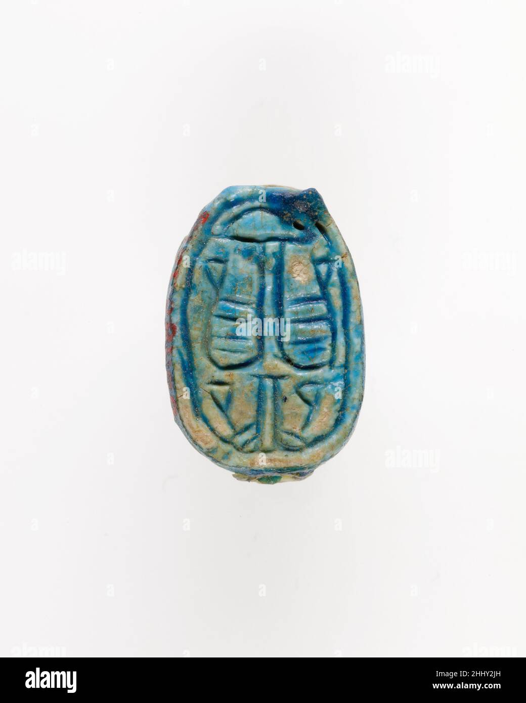 Scarab avec Patryus Décoration de plantes ca.1850–1640 C.-B. Royaume du milieu durant la fin du Royaume du milieu (fin de la dynastie 12–milieu de la dynastie 13, env.1850–1640 B.C), les décorations sur les scaribs montrent souvent des dessins symétriques et des combinaisons de signes et de symboles qui sont bien composés.C'est également le cas pour les décorations florales et végétales, qui consistent en des représentations de plantes papyrus, et de fleurs de lotus et de leurs bourgeons.Les plantes sont un thème populaire sur le dessous des amulettes de phoque parce qu'elles se réfèrent à la vie, le renouvellement, et la régénération.Scarab avec la Décoration de plantes de Patryus 557099 Banque D'Images