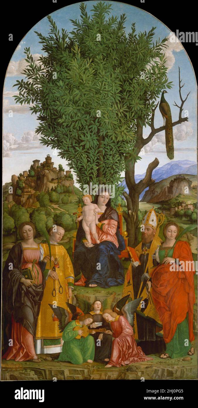 Madonna et l'enfant avec les Saints ca.1520 Girolamo dai Libri Italien les saints (de gauche à droite) sont Catherine d'Alexandrie, Léonard, Augustin et Apollonia. Peint vers 1520 pour l'église Augustinine de San Leonardo nel Monte à l'extérieur de Vérone, l'image a été décrite en longueur par le biographe du XVIe siècle Giorgio Vasari,qui admirait particulièrement le paysage et l'énorme laurier.Tandis que la Madonna et l'enfant reflètent l'œuvre d'Andrea Mantegna, la colline lointaine couronnée d'une forteresse et l'arbre mort sont directement repris de la célèbre gravure de Saint Eustache de Dürer.TH Banque D'Images