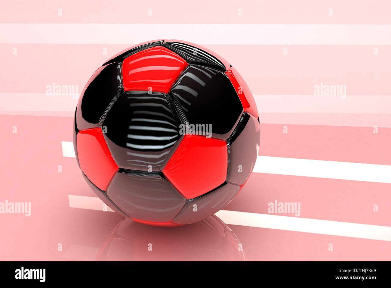 Ballon de football 3D avec finition brillante en rouge et noir sur fond rose Banque D'Images