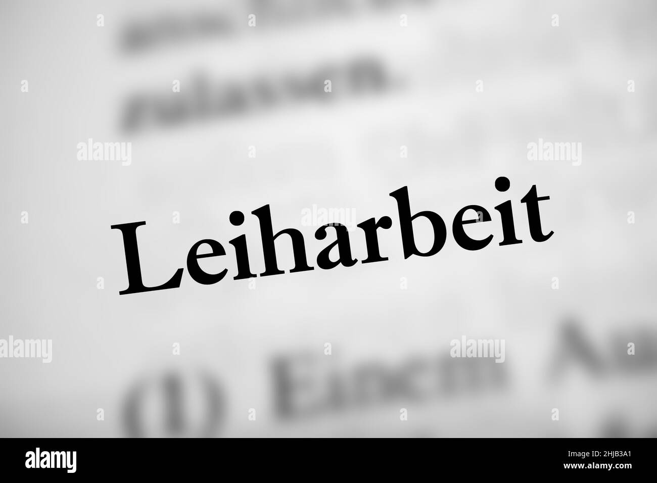 Illustration du mot allemand Leiharbeit signifiant travail temporaire sur le livre blanc Banque D'Images