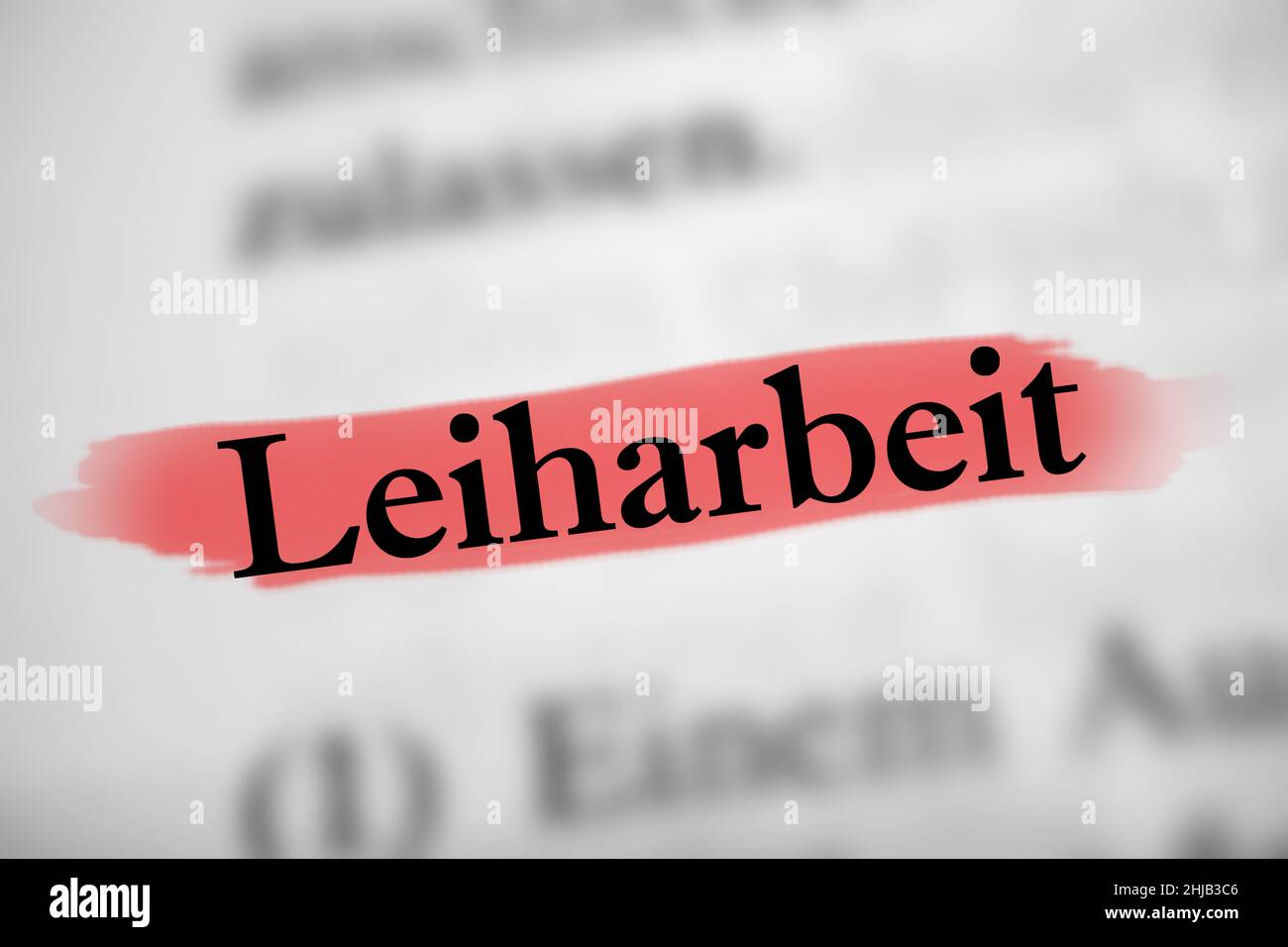 Illustration du mot allemand Leiharbeit signifiant travail temporaire sur le livre blanc Banque D'Images