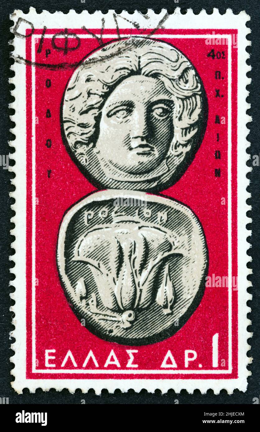 GRÈCE - VERS 1959 : un timbre imprimé en Grèce à partir de l'émission « pièces de monnaie grecques anciennes » montre une pièce de monnaie de Rhodes 4th siècle avant J.-C. (Helios et rose). Banque D'Images