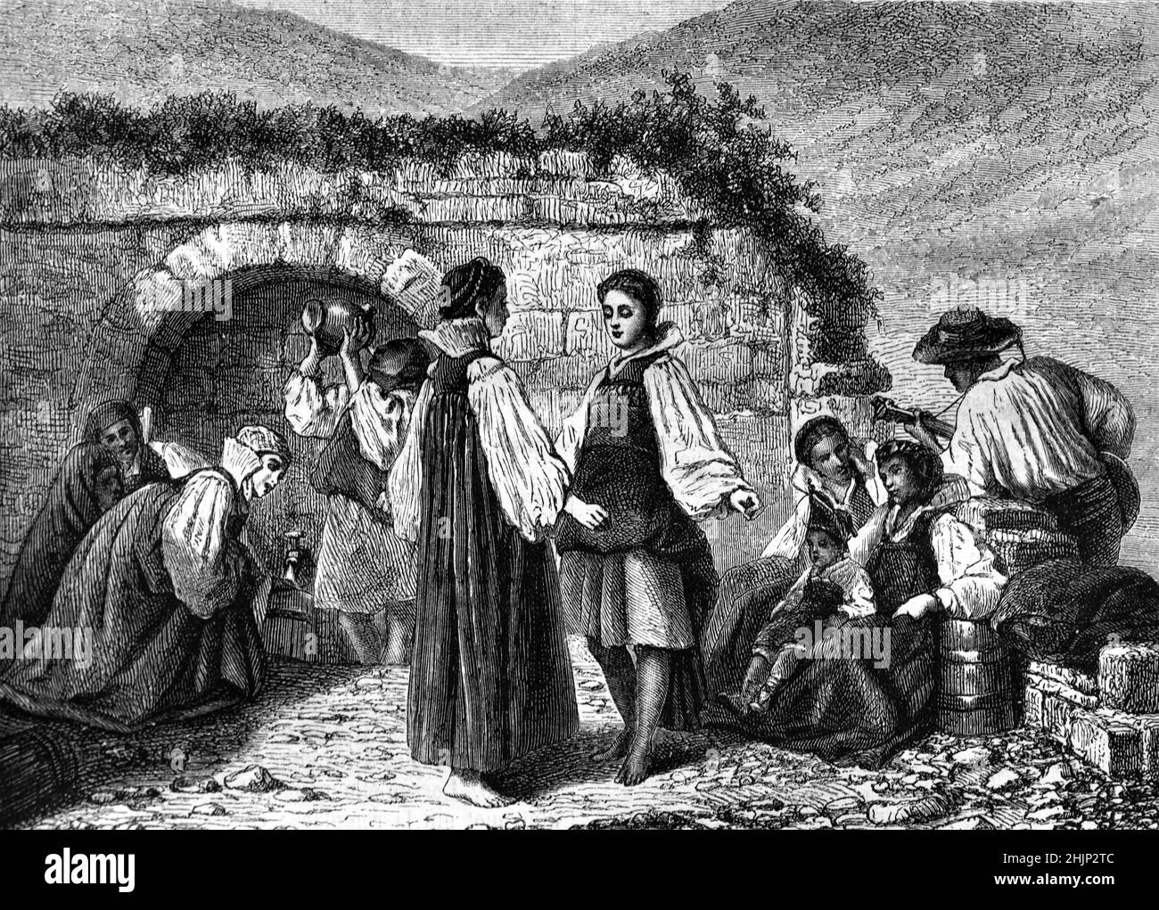 Les femmes espagnoles se rapaiment de l'eau d'une fontaine publique, d'une fontaine de rue ou d'une source d'eau des Pyrénées à Anso Aragon Espagne.1865 Illustration ancienne ou gravure Banque D'Images