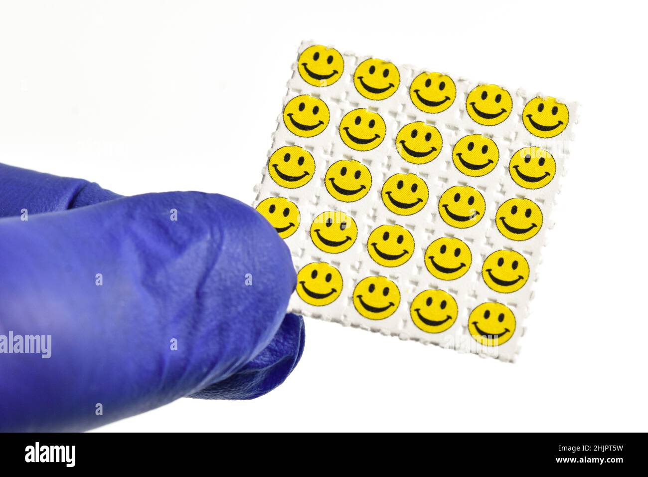 Smiley visage acide trébuchements, papier buvard imprégné de la drogue L. NSVAC- acide lysergique diéthylamide. Banque D'Images