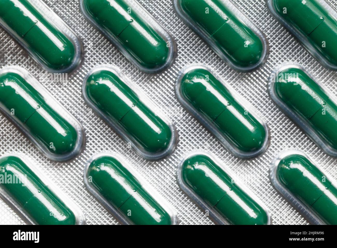 Paquet de capsules vertes, photo en gros plan, vue du dessus Banque D'Images