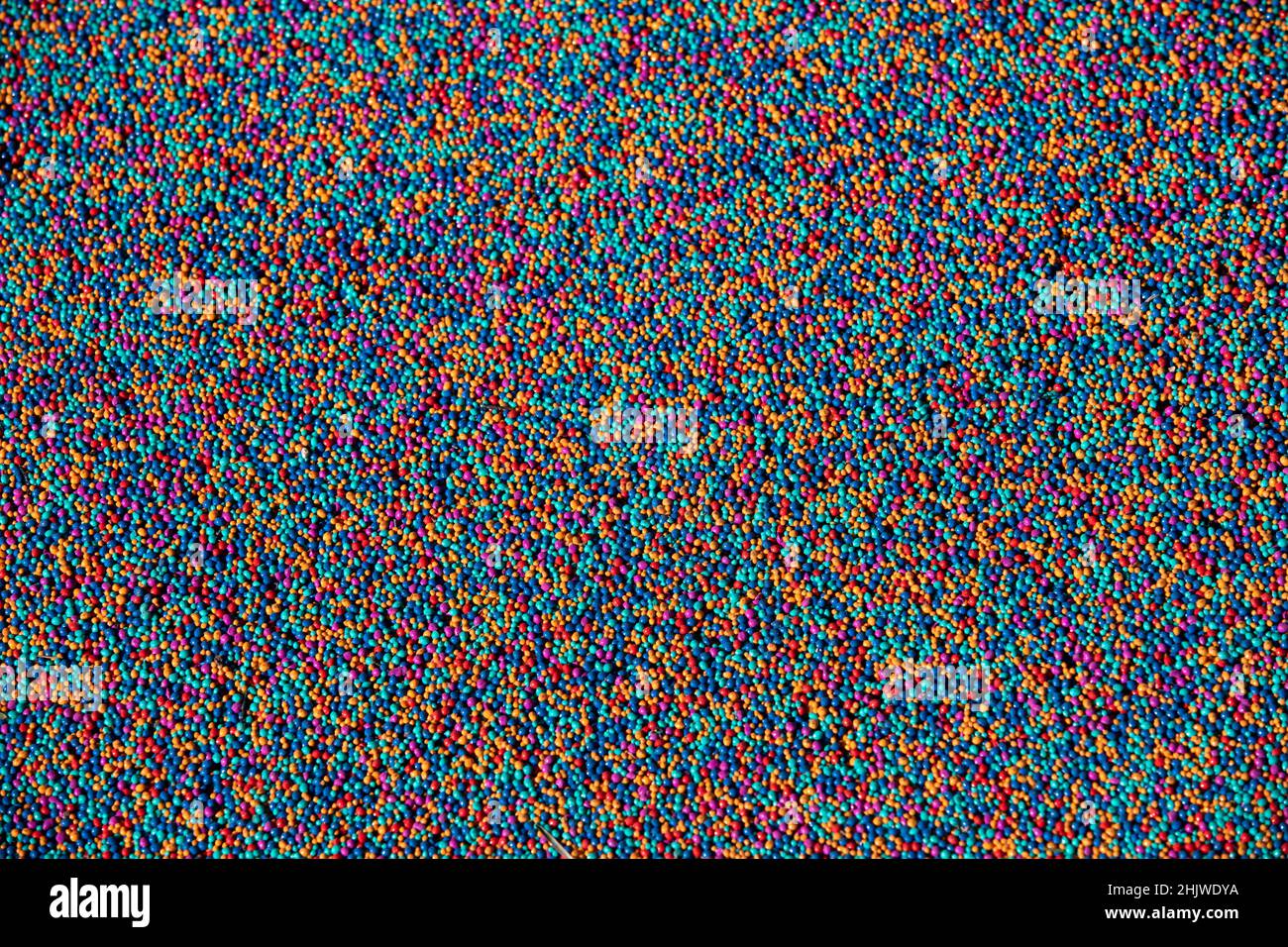 Couleurs arc-en-ciel abstraites colorées d'une surface de jeu en caoutchouc souple. Banque D'Images