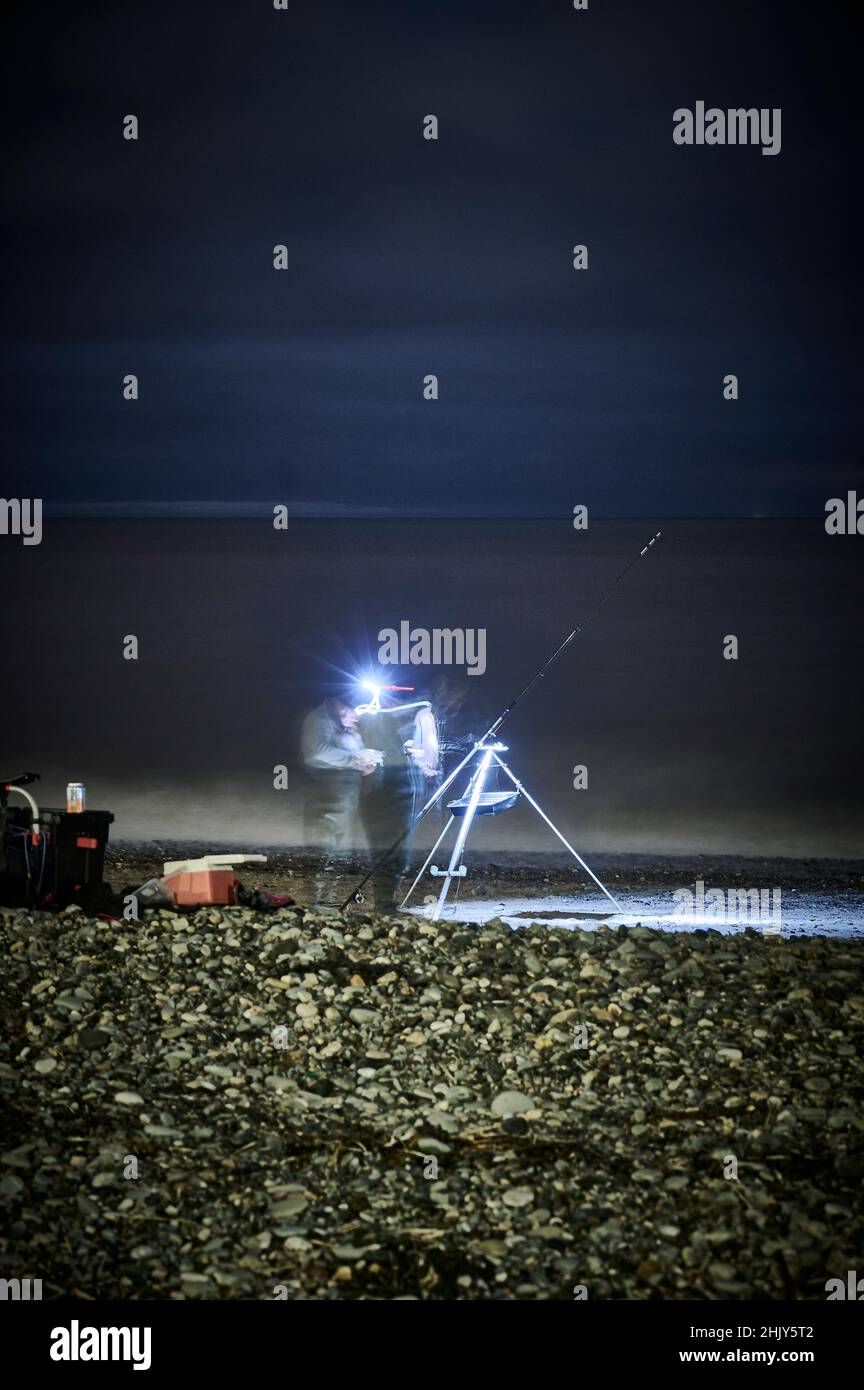 Match de pêche à la ligne de nuit au large de Rossall Beach, Fleetwood, Royaume-Uni Banque D'Images