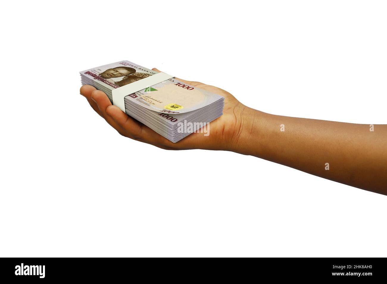 Main tenant 3D pile rendue de notes nigérienne de Naira isolées sur fond blanc Banque D'Images