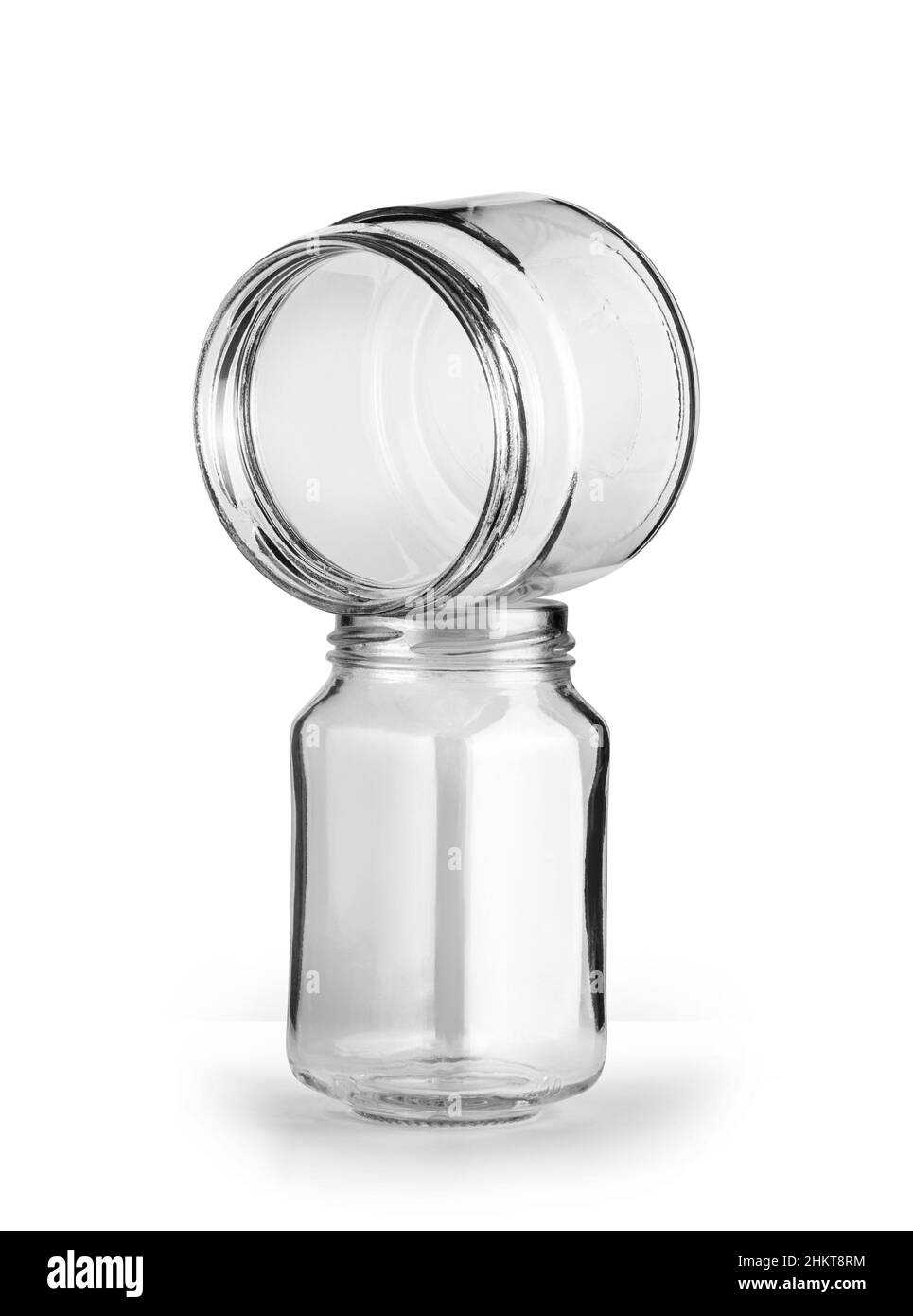 Deux bocal en verre vides isolés sur fond blanc avec un masque Banque D'Images