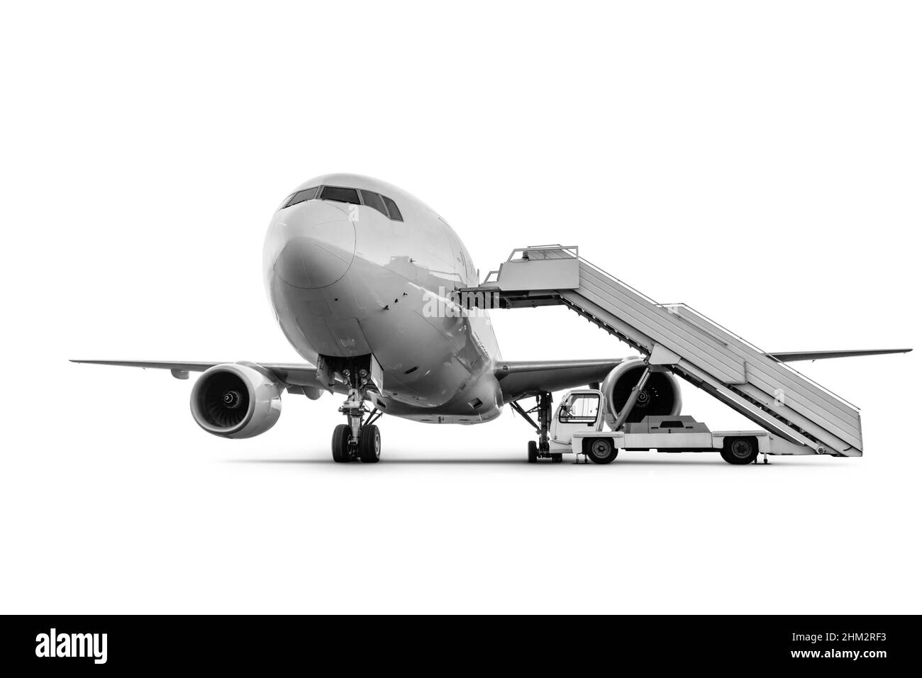 Avion à jet large avec escalier isolé sur fond blanc Banque D'Images