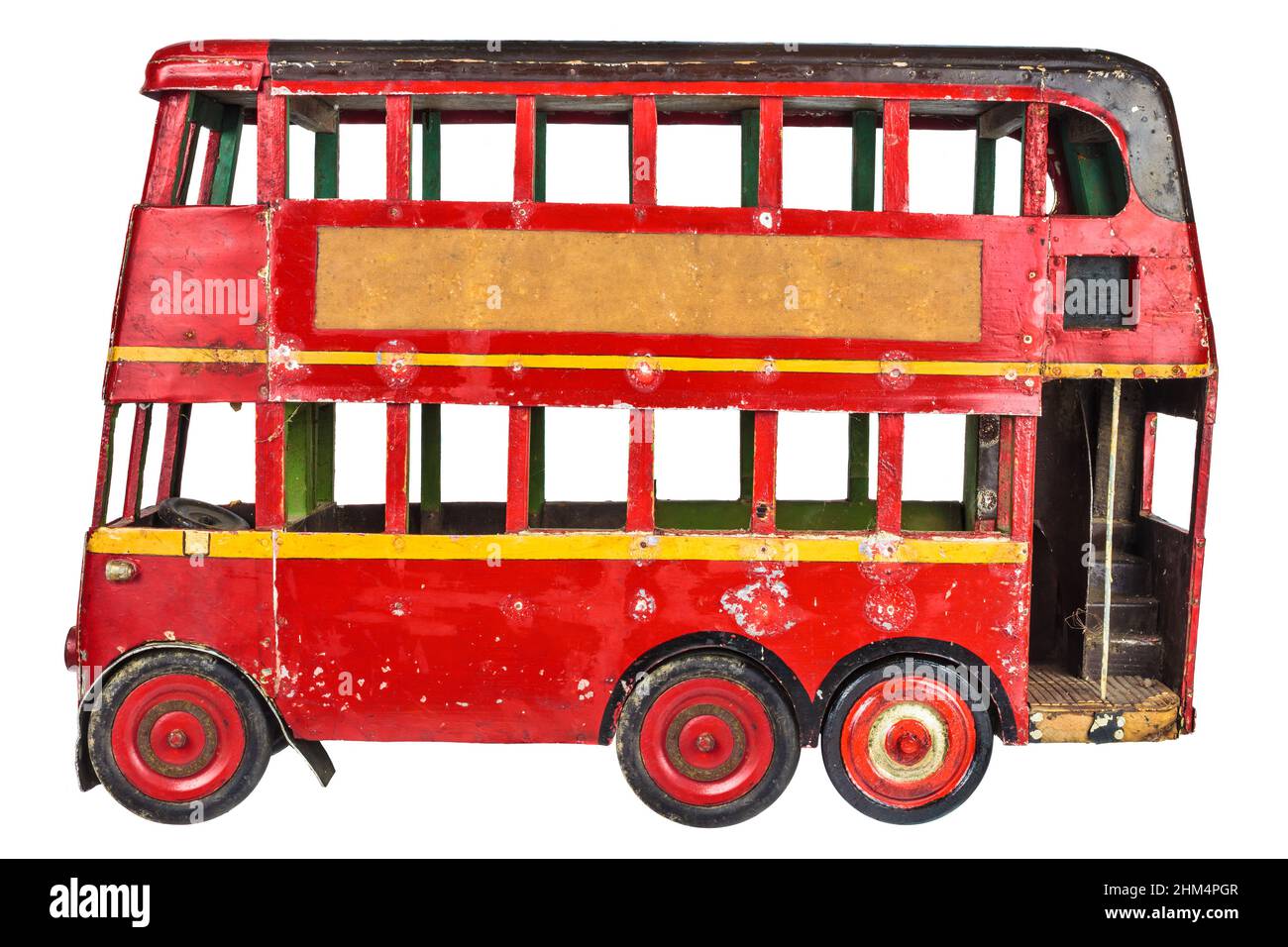 Vintage rouge anglais London bus jouet isolé sur un fond blanc Banque D'Images